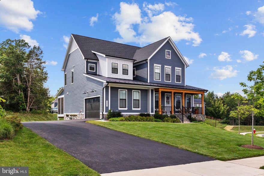 Beautifully designed Craftsman-style home with over $275K in upgrades which is sited on a premium cul-de-sac lot bordering on serene community pond and common area space.  Contemporary open floor plan with LVP flooring through main level, this home offers space, style, and thoughtful design throughout.  Extended and open family room with large dining area.  Main level office with extension perfect for remote office work.  Gourmet kitchen showcases an expansive working island, double ovens, gas cooktop with contemporary range hood, and upgraded refrigerator and dishwasher — perfect for daily living and entertaining. A large mudroom, conveniently located off the kitchen and garage, adds functionality to the main level.  Private primary suite includes a spa-like bath with expansive dual vanity, oversized shower, and a double walk-in closet outfitted with a high-end organization system. Upstairs, you’ll find three additional bedrooms, a huge laundry room, and generous storage.  Finished lower level boasts an enormous rec room with side walk-out areaway, a 5th bedroom, full bath, rough-in for wet bar plus two large unfinished storage areas.   Custom blinds throughout the home.    Two car garage includes charging plug for EVs  Enjoy outdoor living on the screened-in porch or the professionally designed rear stone patio, crafted by a landscape architect for the perfect backyard retreat.