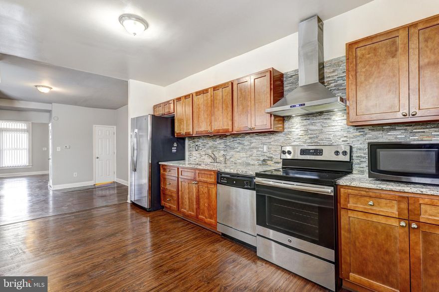 Welcome to 842 Whitmore Ave, a stunning four-bedroom, two-and-a-half-bathroom gem nestled in the heart of charming Baltimore City. This beautiful home combines modern amenities with classic charm and is conveniently located near major highways and local shops/restaurants.

As you step inside, you'll be greeted by an abundance of natural light that bathes the space in warmth. The gleaming hardwood floors lead you through an inviting interior that effortlessly blends style and functionality.

The gourmet kitchen is a chef's dream, boasting stainless steel appliances, a mesmerizing mosaic backsplash, and elegant granite countertops. Whether you're preparing a casual meal or entertaining guests, this kitchen is sure to inspire your culinary creativity.

The top level of the home is dedicated to tranquility, featuring three spacious bedrooms and a well-appointed full bathroom. Each room offers a retreat-like atmosphere, perfect for unwinding after a busy day.

The fully finished basement adds valuable living space to this already impressive home. Recessed lighting illuminates the space, creating a cozy ambiance. The basement includes an additional bedroom and a full bathroom, providing flexibility for guests, a home office, or a recreational area.

Outdoor living is a delight with a one-car garage and a fenced-in back patio. Whether you enjoy morning coffee al fresco or hosting summer barbecues, this space offers the perfect blend of privacy and convenience.

This residence is not just a home; it's a lifestyle. Experience the best of Baltimore living with a property that seamlessly combines comfort, style, and accessibility. Don't miss the opportunity to make 842 Whitmore Ave your new home sweet home.