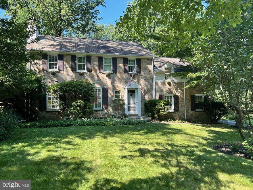 Come and enjoy this lovely Stone Colonial located in the heart of Devon. Situated on a well landscaped flat lot surrounded by a beautiful stone wall and a fenced in lush backyard. The owners created a chef's outdoor bar-be-cue with two custom islands and built in grill that will become your family entertainment center. Built with "old world" style and grace. Award winning T/E schools. Paradise Kitchen renovation with white cabinets, granite center island with double sinks, imported Italian granite counter tops, double ovens (one convection), built-in microwave, cook-top, wet bar and an inviting eating area over-looking the grounds through huge atrium window and French sliders to secluded patio. Living Room with large windows, built-ins and fireplace. Dining Room with two large windows and glass door to patio. Family Room with built-in book shelves and a charming walk-in welcoming fireplace with a window built by Hank Belber. The stairs to the second floor are open and extra wide. Primary Bedroom suite w/French doors, two closets, sitting area, renovated bath with seamless shower and two vessel sinks with Corian vanities. Bedroom two was the previous Primary Bedroom and has a full bath with walk-in shower. Bedrooms three and four are large and sunny. Hall Bath with subway tile, bead board and imported sink. Hardwood flooring throughout except the Family Room. Pella replacement windows on the second floor. Full walk-out unfinished basement through Bilco doors. Pull down stairs to large walkable attic. Secluded beautifully maintained magical back yard. Two car attached garage with extra parking in back of house. Walking distance to the Devon train. Close to everything!!!!