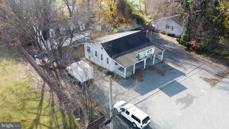 Great Opportunity to live work and play! Nice 3 bedroom 2 Bath Rancher home  - Plus this place is perfect for a Small Contractor, Plumber, Electrician, ect - Run your business from here! Loads of Parking, Large 3 Car Detached Garage with Full Height Space Above. Former Store Building too, all Located in a Premium Howard County Location at the Corner of RT 40 and Frederick Road! House is in pretty good shape, garage needs a roof and former Commercial Building needs a roof and some work! Need a Cash offer with Proof of Funds. Offers due by  end of day on 12/5/24 - working with lender to do quick sale & coordinate settlement that works for the buyer! Seller Prefers working with Sage Title and Christophe Lowther as they are already woring on this file.