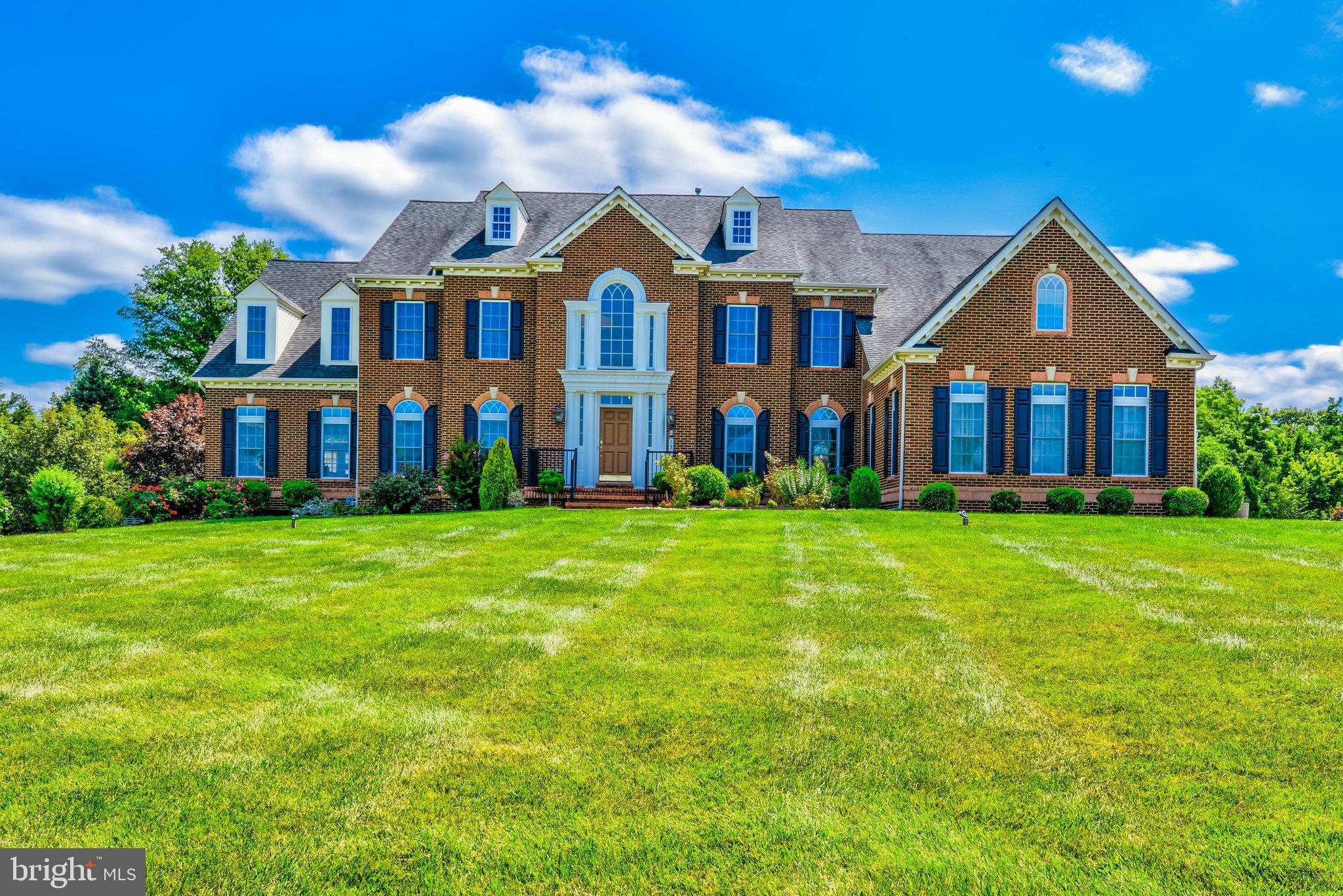 Welcome to this magnificent 6-bedroom, 5 full bath, and 2 half bath home in Newtown, PA Montecello model By NV homes. This gorgeous and well-maintained home spans 6,203 SF over 2 floors (as well as a 3,000 SF fully finished basement!) and is full of amazing features such as a Huge bar and private backyard and amazing patios. Enter directly into the grand 2-story foyer on the main level of the home, complete with sky-high ceilings and wainscotting, and 3 piece crown moldings. Beautiful hardwood flooring and crown molding are throughout this level. To the left is a large formal sitting room which leads into an even more spacious bright and sunny family room. The formal dining room is expansive, with floor-to-ceiling window and panel molding throughout. In the center of the main level is the huge 2-story great room/family room, with soaring high ceilings, huge arched window, gas insert fireplace, and beautiful built-in wooden shelving. The gourmet eat-in kitchen is equally as stunning, large stainless steel appliances, a central island, and a butlers pantry. Right off of the kitchen is a morning room surrounded by floor-to-ceiling windows filling the space with great natural light. Huge deck of the kitchen in addition to the patios. Also on this level is a spacious office/study, laundry room, half bathroom, second kitchen, and two half bathrooms. Up the butterfly staircase on the 2nd level of the home, you will find the huge master bedroom containing a large, connected sitting room, skylight, and 2 walk-in closets! The ensuite master bathroom contains a walk-through shower and a large jacuzzi tub. There are an additional four bedrooms on this level - all sizable with wall-to-wall BRAND NEW carpeting. Two of the bedrooms also feature walk-in closets and ensuite full bathrooms! Rounding out the interior of the home is a spectacular fully finished basement. This lower level includes a full bar, media room, additional den/family rooms, fitness room, and full bathroom with a gorgeous glass-enclosed stall shower. Double doors in the lower level lead out into the backyard patio and the additional patio. The property is surrounded by scenic grounds and beautiful well-kept landscaping, a fenced vegetable garden, and lots of privacy. Additional features of the home include keyless entries, natural gas standby house generator(2021), and a water softener and whole house water purifier(2019), and a reverse osmosis drinking water system.. 157 Parsons Ln is ideally situated in the highly-rated Council Rock School district, and close to major highways as well as the dining and shops of Historic Newtown. This home has everything you need and much more! Don't miss out; schedule your appointment today!