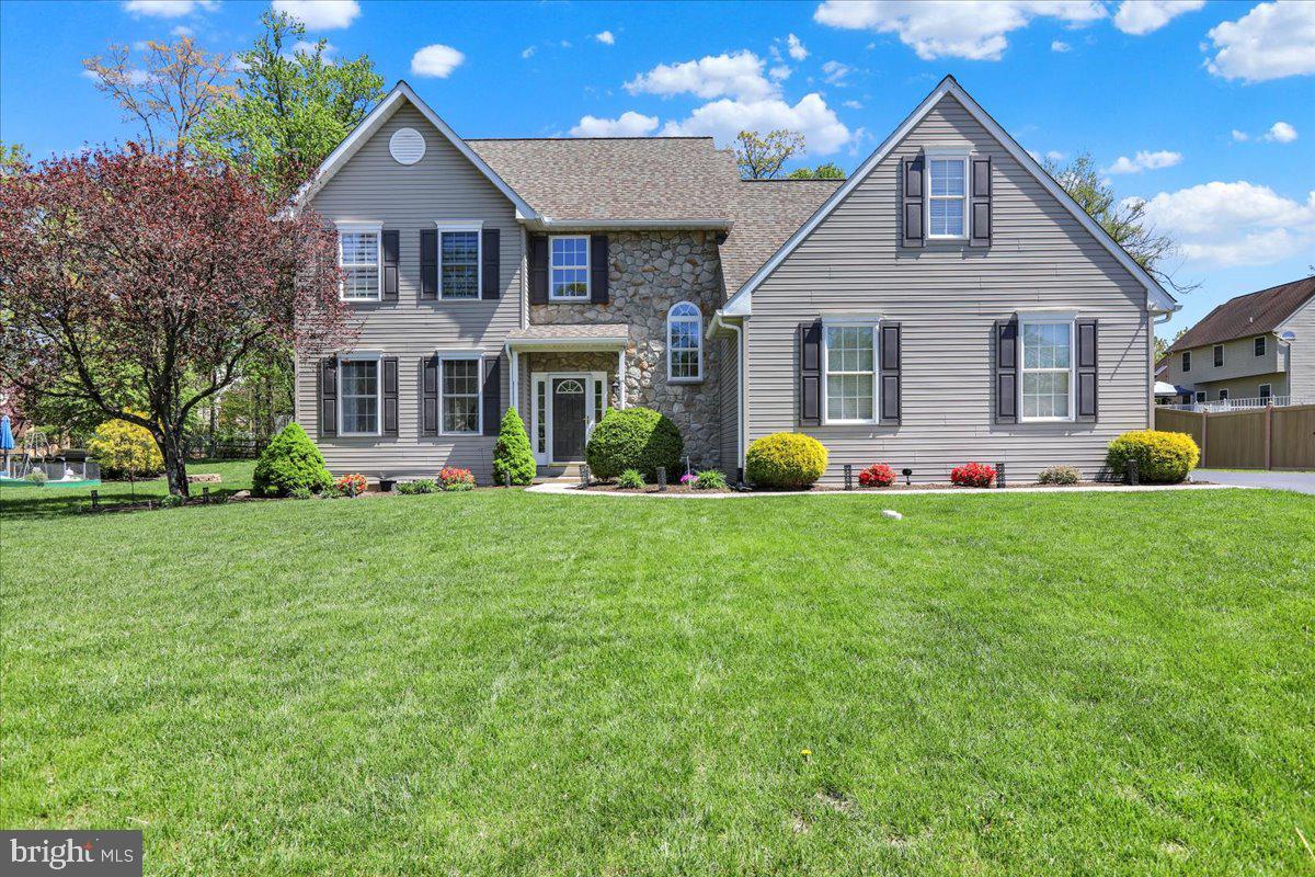 Welcome to this 4-bedroom, 2.5 bath colonial home located in Greenbriar in Amity Township, within the Daniel Boone School District. This stunning two-story home is located on a gorgeous lot in a peaceful and quiet neighborhood. This home offers the perfect combination of classic charm and modern upgrades, providing ample space and comfort for today’s lifestyle. The open floor plan boasts vaulted ceilings in the family room, featuring a beautiful stone gas fireplace that seamlessly connects to the kitchen and breakfast area. The kitchen, which underwent renovation, is a chef’s dream featuring newer appliances, a stylish tile backsplash, huge island, all complemented by quartz countertops. The entire first floor has LVP flooring for easy care and cleaning. The master bathroom has been updated with a new vanity, mirrors, comfort height toilet and walk-in shower. The remaining bathrooms have each been outfitted with new toilets, and vanities. The entire home has been thoughtfully updated with the kind of finishing touches that really grab your attention. Upstairs, you'll find 3 additional bedrooms along with ample closet space. The oversized side-entry garage provides plenty of storage space, for your outdoor equipment. In case that space isn’t enough, there is a newer 10 x 12 storage shed. Other features in the back yard include a large stamped concrete patio, and Coleman hot tub. This space is a true oasis and the perfect place to entertain. The unfinished basement is a blank canvas and can be used for storage or future expansion. So many UPDATES and UPGRADES! This is a GORGEOUS, well-kept and well-maintained ONE owner home. If this house could speak, it would talk about things like love, kindness, family, joy, and just downright good vibes! If you are looking for a family home to share with the people you love the most, you don’t want to pass this one by. Schedule your personal tour today. I promise it will not disappoint!