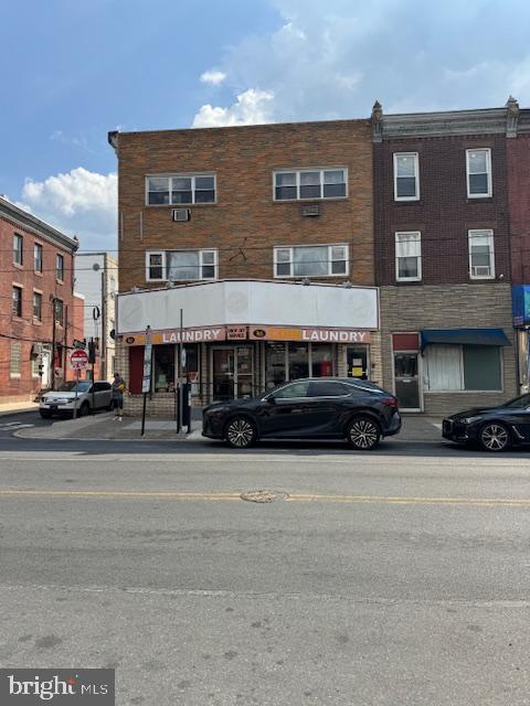 Commercial building in the booming south Philadelphia. Turn key laundry business. Very active AND MAKES MONEY FOR YOU. The 2nd fllor and 3rd floor had partially used as professional office previously which can be easily restored, Or changed to residentail units.