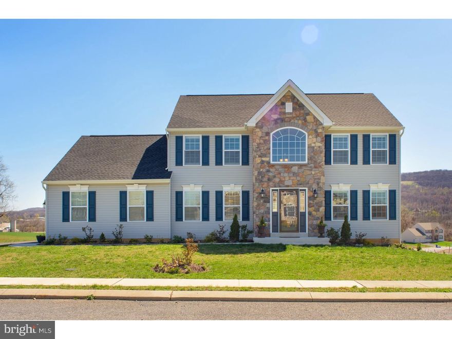 Everything you want abounds in this immaculate, spacious, 2-year-old home. Situated on a premium corner lot, in the desirable subdivision of Willow Glen, this home will be the envy of all your friends. The grand 2-story tiled foyer leads into the generous first floor with a formal dining room and living room, and then back to the large eat-in kitchen with brushed nickle lighting, upgraded maple cabinetry, stainless steel appliances, and breakfast island - transitioning seamlessly into the comfortable open concept family room which has modern track-lighting and a classic mantled gas fireplace. Upstairs you will find three large bedrooms, a double sink hallway bath, and a big master bedroom suite - complete with a full master bath with double sink corian counter vanity, separate shower, and tiled whirlpool tub - AND a HUGE walk-in closet with approx $4500 of custom built-in organizers! And did I mention that every window in the house has been upgraded with expensive inside mount shutters?  Or the 2-car side-entry garage and flat driveway? Or the view of the farm and far off mountains? Call today for your private showing. You will not be disappointed.