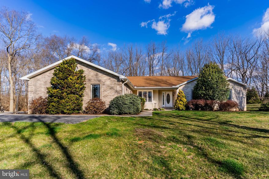 **Charming Ranch Home in Serene Country Subdivision** Welcome to your dream retreat! Nestled on a peaceful cul-de-sac in Greystone Acres, West Pennsboro Township,  this stunning ranch home offers the perfect blend of modern comfort and country charm on an expansive 2.11 acre lot. With three spacious bedrooms and two and a half baths, this home is sure to be the one you're looking for! Step inside to discover a beautifully designed open-concept layout that seamlessly connects the living spaces, bathed in plenty of natural light. The heart of the home is undoubtedly the exquisite kitchen, featuring rich hickory cabinets and solid countertops that provide both style and functionality. A generous pantry ensures you have all the storage space you need for your culinary adventures.  The kitchen is open to the cozy family room with its propane stove to enjoy on chilly winter evenings.  Enjoy year-round comfort in the delightful four-season room—ideal for sipping morning coffee or unwinding with a good book as you take in views of your fenced rear yard. Step outside onto your large covered composite deck—perfect for entertaining guests or simply enjoying quiet moments surrounded by nature. Additional features include convenient main-level laundry facilities, a dedicated office space located on the lower level for remote work or study, and even a canning kitchen—ideal for preserving those homegrown delights from your own garden! This property truly embodies modern, single level country living at its finest. Don’t miss out on this rare opportunity to own such an exceptional home where tranquility meets sophistication. **Schedule your private tour today! This gem won’t last long—experience firsthand all that this beautiful ranch home has to offer!**