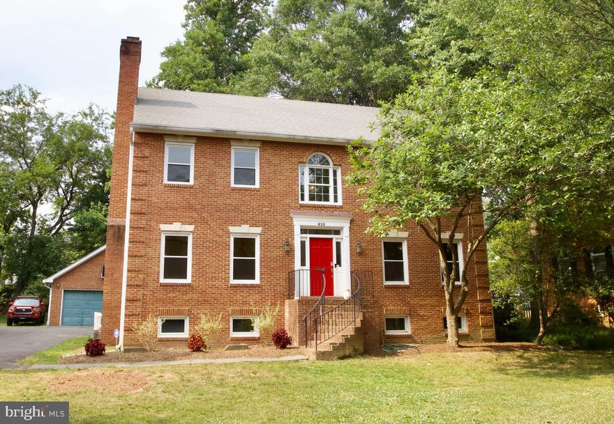 Fantastic opportunity to own a large, classic colonial with 2-car detached garage in FC City and to make it your own! Set on a quiet cul-de-sac this home built in 1989 offers great spaces throughout including a 2-story entry foyer, spacious living room with wood burning fireplace, home office with built-ins, formal dining room, family room with vaulted ceiling and stone fireplace surround, an open and spacious eat-in kitchen  and mud room/laundry room combo.  Upstairs you'll find a primary bedroom  with walk-in closet and en suite bath, double vanity, soaking tub and shower. Just down the hall are 3 more bedrooms that share a hall bath. The lower level features a generously sized family room with wet bar, an additional washer and dryer set, and two rooms that could easily be converted to legal bedrooms or used as office and game room. A large unfinished storage space rounds out the level. Outside you'll enjoy the flat lot, fenced in rear yard and deck.  Just steps away from Lincoln Park, the Falls Church Community Center and all the shops and restaurants Falls Church has to offer. Home is priced to reflect the condition and the opportunity to do some work to make it your own!