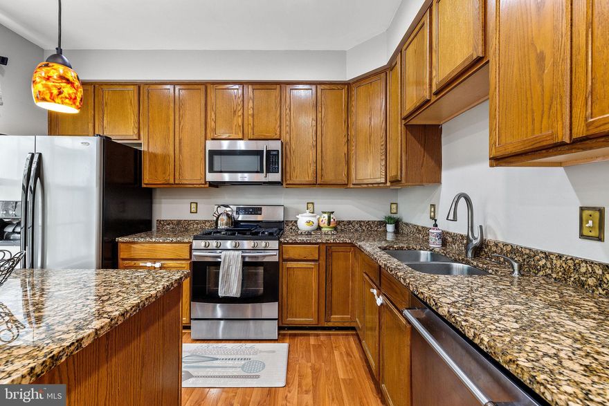 Price Reduction! Fall in love with this home before it's gone! 

Welcome to this beautifully maintained 3-story townhome in a quiet cul-de-sac within the highly desirable McNair Farms subdivision of Herndon. Offering nearly 2,000 square feet of living space, this home features 3 bedrooms, 3 full baths, and 1 half bath, along with a dedicated office and a versatile recreation room on the entry level — perfect for modern living and entertaining.

Enjoy sunny days and warm evenings on the deck and lower-level patio, while the inviting interior showcases cherry hardwood floors and an updated kitchen with granite countertops, stainless steel appliances, and an island that opens to a formal dining room and cozy family room. Upstairs, retreat to the spacious primary suite complete with a walk-in closet and ensuite bath featuring double sinks, a soaking tub, and a separate shower. Two additional bedrooms share a full bath.

The fully finished entry level also offers an office or private room, washer/dryer, and a full bath — providing endless possibilities for an in-law suite or additional recreation space with garage access (which conveys a large tool cabinet). Recent upgrades include new outdoor light fixtures, garage door (2025), water heater (2025), and HVAC (2024). Roof is estimated at 5–7 years old.

Located near major commuter routes, abundant shopping, dining, and amenities including tot-lots, tennis, and basketball courts. Minutes from the Village Center at Dulles, Arrowbrook Centre, the Silver Line Metro, Dulles Technology Corridor, and Dulles Toll Road. This move-in ready home also conveys with a 1-year home warranty for peace of mind. Don’t miss your second chance to make this wonderful property your new home!