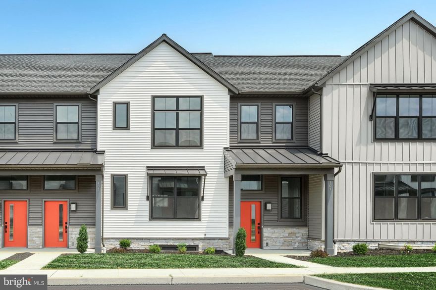 This 2-story townhome includes a 1-car, rear load garage, mudroom entry with a built-in bench, and a patio for outdoor living. The kitchen is well equipped with stainless steel appliances, attractive cabinetry, and granite countertops. The kitchen opens to a spacious dining area and adjacent to a sunny living room. The 2nd floor owner’s suite features an expansive closet, and a private bathroom with a double bowl vanity and 5’ shower. Across from the suite are 2 additional bedrooms, a full bathroom, and a convenient laundry room.