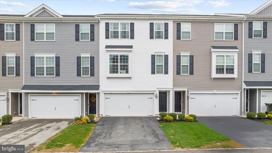 Beautifully maintained and move-in ready, this 3-bedroom, 2 full and 2 half bath townhome offers over 2,200 square feet of stylish, low-maintenance living with peaceful nature views.  Driving through the community, you’ll immediately notice the well-maintained homes, lovely landscaping, and inviting curb appeal that set the tone for this beautiful property.  The open main level is bright and welcoming, featuring recessed lighting, updated flooring, and a spacious living and dining area filled with natural light. The modern kitchen is a true showstopper—showcasing white cabinetry, granite countertops, stainless steel appliances, and a generous center island that opens to the dining area, making it perfect for entertaining and hosting during the holidays. Sliding doors lead to a spacious deck overlooking the trees and pond, creating the perfect setting for outdoor dining, relaxing with a cup of coffee, or entertaining guests while enjoying the beautiful nature views.  Upstairs, the primary suite offers a walk-in closet and a beautifully appointed ensuite bathroom with a double sink vanity and stall shower. Two additional bedrooms, a full hall bath, and a conveniently located laundry area complete the upper level.  The finished walk-out lower level provides a versatile space—perfect for movie nights, a home gym, office, or game-day gatherings—with a half bath and direct access to the two-car garage. The garage not only keeps your vehicles protected from the elements but also offers additional space for storage.  Enjoy a carefree lifestyle with HOA services that include lawn care, snow removal, trash, and exterior maintenance. Ideally located just minutes from shopping, dining, and major routes 309, 78, and 476, this home combines comfort, convenience, and contemporary living at its best.