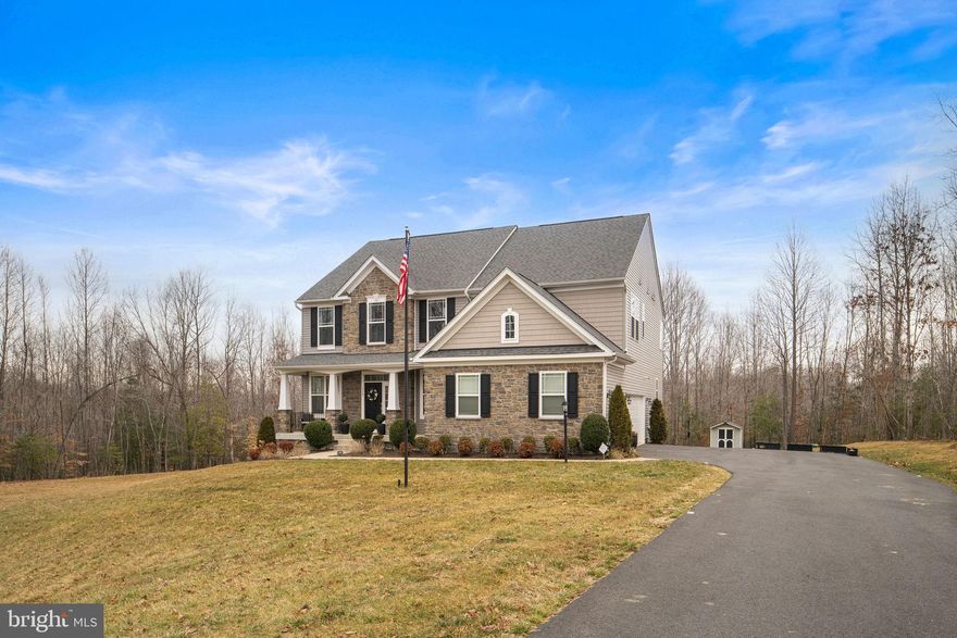 Nestled within the prestigious Liberty Hall community, this exquisite Craftsman-style residence, built in 2021, offers a harmonious blend of luxury and comfort, set against a backdrop of lush landscaping on a sprawling 1.53-acre lot. The exterior showcases a stunning combination of vinyl siding and stone, exuding timeless elegance while ensuring durability. Step inside to discover an expansive, thoughtfully designed interior that boasts five spacious bedrooms and four and a half opulent bathrooms. The open floor plan seamlessly integrates the gourmet kitchen with the living and dining areas, creating an inviting space perfect for both entertaining and everyday living. The kitchen is a chef's dream, featuring upgraded countertops, a generous island, and stainless steel appliances, including a built-in microwave, dishwasher, and refrigerator. The butler's pantry adds an extra touch of sophistication, providing ample storage and prep space. Natural light floods the home through strategically placed windows, highlighting the exquisite details such as chair railings and recessed lighting. The living area is perfect for intimate gatherings or quiet evenings at home. Each bedroom is designed with comfort in mind, featuring walk-in closets that provide ample storage and organization. The luxurious bathrooms are a true retreat, with features like walk-in showers and elegant tub-shower combinations, ensuring a spa-like experience at home. The upper-level laundry room adds convenience to daily routines, while the fully finished basement, complete with a walkout level, offers additional living space that can be tailored to your lifestyle-be it a home theater, gym, or playroom. Step outside to enjoy the privacy of the grounds, complete with a lawn sprinkler system that ensures your outdoor oasis remains vibrant year-round. Multiple outdoor spaces, including an porch, expansive deck with remote, retractable shades, and an inviting patio which provides the perfect setting for alfresco dining or simply soaking in the serene surroundings. With a side-entry attached garage accommodating three vehicles and a driveway that can host up to twelve additional cars, this property is designed for both functionality and elegance. Experience the exclusive lifestyle that this remarkable home offers, where luxury meets comfort in every detail.  Conveniently located near 95 for commuters and Warrenton Road for the needs of every day essentials.