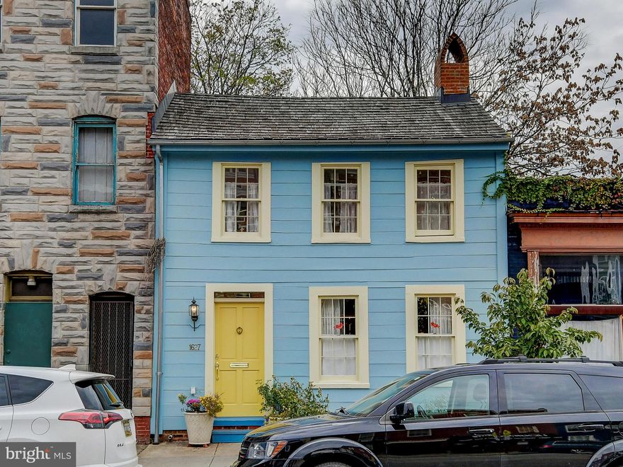 48 hour showing notice required. Your country cottage in the city, combining quaint charm with the best of urban living. Perhaps the oldest, and largest, surviving wooden house in Baltimore, this home was built in 1787 and completely restored in 2011 with additional improvements in 2014. The cozy living room features a 19th century decorative mirrored fireplace. The open kitchen and dining room floor plan adds a modern feel to this period home. The updated kitchen has marble counters and custom cabinetry. The first floor powder room is right off the kitchen. Step through the back door onto a landscaped brick patio with plenty of room to entertain. The second floor primary bedroom overlooks the yard and includes a built-in dresser with marble top. A second floor full bath has a skylight and built-in storage under a marble counter and laundry closet. A generous walk in closet is located in the center of the home. The second bedroom is in the front of the home with two large windows overlooking Aliceanna Street, with an attached closet. This home is ideally located just steps from the Fell's Point waterfront with its many dining and entertainment options, and is within easy walking distance to Harbor East and the flagship Whole Foods market. The North Market food hall and South Market Choptank crab house are just around the corner, while the elegant new Pendry Hotel is three blocks away. Once the home of Nicolas Leeke, a schoolmaster, and later of the famous privateer of the war of 1812, Captain Thomas Boyle, this house was awarded The Preserve America Steward Award, signed by Michelle Obama, in 2012.