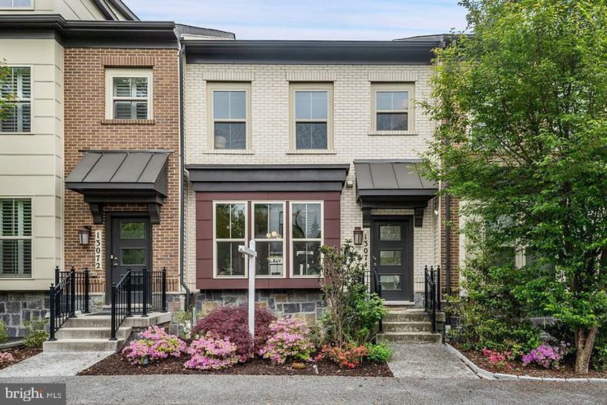 This premium 2020 Craftmark luxury townhome in Mateny Hill offers four levels of sophisticated living, offers 3 Bedrooms with 3 full baths and 2 half baths, highlighted by an open-concept living, dining, and kitchen area featuring a large custom mudroom upon entry, walkout large deck perfect for outdoor entertaining, and a convenient half bath on the same main living floor—an ideal layout for hosting. The kitchen is a focal point, equipped with gourmet-style stainless steel, energy efficient GE appliances, quartz countertops, premium cabinetry with under-cabinet lighting, an expansive double door pantry, and custom lighting over the very large central island. The living room offers custom built in shelving for the TV entertainment space. The home features large windows throughout, outfitted with custom real wood blinds, 5.5 in hardwoods in main living areas, and real oak stairs. Each of the three spacious bedrooms located throughout the third and fourth levels serves as a private sanctuary including their own bathrooms, ceiling fans, and walk-in closets. On the third level the washer and dryer is located for easy convenience. The walk-out basement offers a large window, a half bath, and flexible space for a fourth guest room, gym or playroom, complemented by a custom built second mudroom, two-car garage with ample room to park two cars and use for storage. The private driveway also has additional parking for 2 more cars. Perfectly positioned for an effortless commute, the home is walking distance to the MARC station, bus stops, and a short drive to I-270 and Shady Grove metro. Located walking distance to the highly rated Germantown Elementary School and a short drive to recreational parks including Great Seneca Park and the Germantown Sports plex. Community amenities include a private playground, picnic table area, snow removal and landscaping, creating a comfortable lifestyle. Extensive dining and shopping at Germantown Town Center and Milestone Center are within minutes for easy convenience. Come experience the luxurious, serene, comfortable living that this home has to offer.
