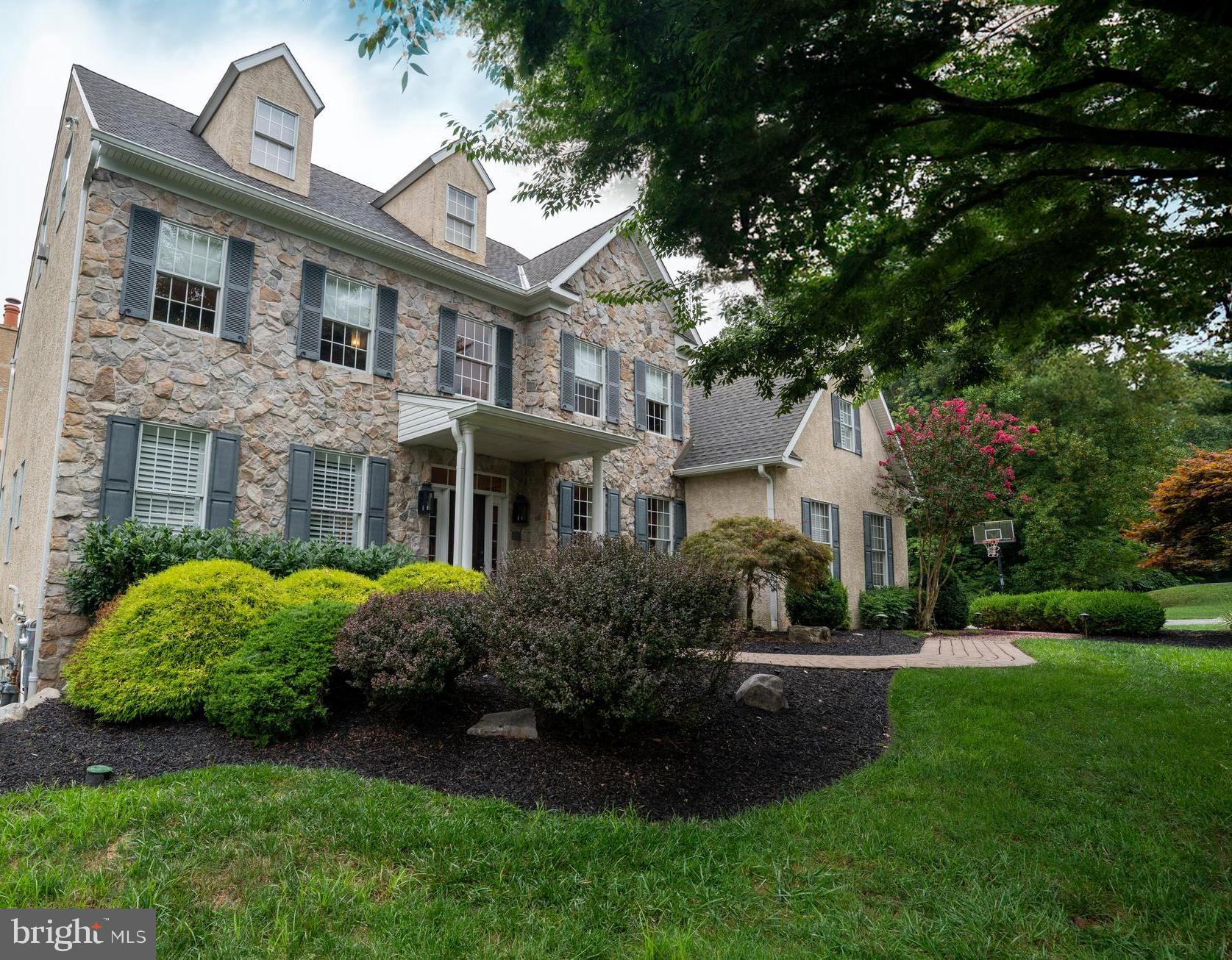 Welcome to 2312 Holly Lane, Lafayette Hill – a refined, elegant residence that combines sophistication with luxurious living. The unique interior layout features 6 bedrooms, 4.5 bathrooms, and 4 finished floors.
Entering the main floor, you are greeted by a bright, open-concept space filled with natural light. A gourmet kitchen features pristine granite countertops with an island, hand-blown glass lighting, custom cabinets, a large pantry, and high ceilings. An adjacent breakfast area with vaulted ceilings provides an airy and relaxing atmosphere. Beside the kitchen, there is an elevated deck and dedicated grilling area with a scenic view.
Centrally situated, the formal living room is highlighted by 20-foot ceilings and a grand, stone mantle fireplace. This inviting space opens to a bright sunroom with panoramic views and a gas fireplace. Interchangeable window panels and radiant heated floors allow for year-round enjoyment. Adjacent to the living room is a cozy den, perfect for family gatherings and movie nights.
The formal dining room, adorned with crown molding, offers an elegant setting for entertaining guests. Glass French doors lead to a library that provides a quiet, tranquil workspace. The laundry room, situated next to the garage and mudroom, adds to the home’s practicality. Throughout the main floor, the solid hardwood flooring adds a touch of warmth and sophistication.
Ascending to the second floor, you will find the main bedroom with an en-suite bathroom, a true retreat. It features quartzite countertops, high-end fixtures, an extra-large soaking tub, a large walk-in shower, custom built-in drawers and cabinets, and individual his and hers closets. The additional three bedrooms on this floor are equally impressive, with two full bathrooms, ensuring comfort and convenience for all.
This one-of-a-kind home features a fully finished attic and basement. An open staircase leads to the attic, where you will find a large bonus room ready for your entertainment needs. This large living space has multiple storage spaces, making it a versatile area for various needs. The walk-out basement is a haven of entertainment, fitness, and relaxation. It features a large living room with a fireplace and flat-screen television equipped with surround sound speakers. Two additional bedrooms, a full bath, a gym with mirrors, and a large cedar sauna provide additional amenities. A modern bar complete with a wine refrigerator and a beverage refrigerator is perfect for entertaining guests. French doors lead to a covered patio with a stunning travertine pool area and spa. Connecting to the pool area is an additional hard-scaped terrace with a waterfall and koi pond, creating a serene outdoor oasis.
The exterior of the home adds to its allure. The two-car garage and large driveway provide ample parking space. The yard, equipped with an irrigation system in both the front and back, ensures lush and well-maintained landscaping.
Offering an unmatched level of luxury, this property in Lafayette Hill is a rare find for those seeking both sophistication and comfort.