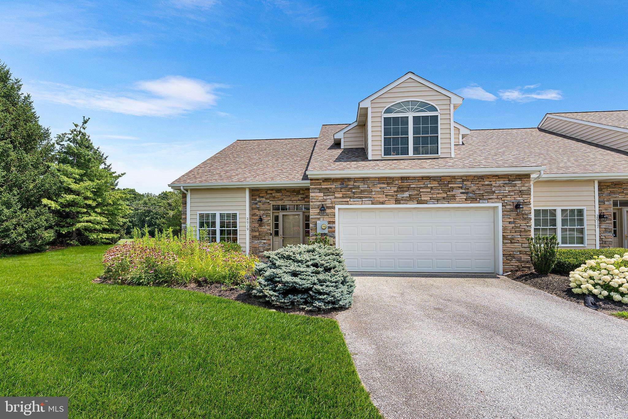 Welcome to this beautiful, open, and airy home in the desirable Spring Meadows community! Step inside to a spacious main-level primary suite with a full bath and dual vanity, plus a convenient half bath for guests. The open living room flows into a bright kitchen and dining area, perfect for entertaining or everyday living. Upstairs, enjoy two generously sized bedrooms and a full bath—ideal for guests, or a home office. This home also features an attached 2-car garage and additional driveway parking for ultimate convenience. Come see it for yourself—schedule your tour today!