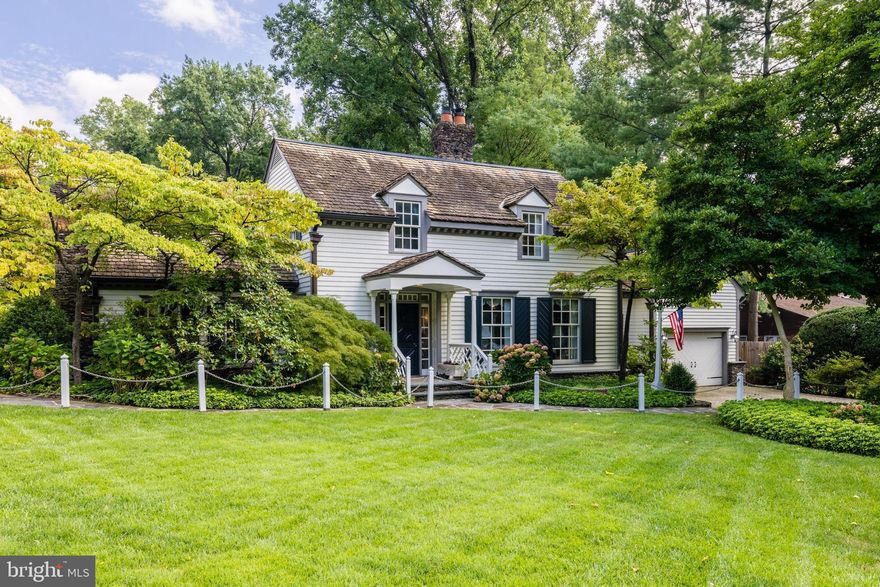 Located in the quiet neighborhood of Sleepy Hollow, this award winning, classic 1933 home feels like it belongs in the Virginia countryside. From the sprawling, serene backyard with its mature and beautiful gardens, to the fabulous curb appeal, this award winning residence blends classic colonial charm with an incredibly convenient location and modern amenities.

Inside, the home offers approx 3,300 sq ft of light-filled finished space across three levels, including three bedrooms, three and a half bathrooms, and a two-car tandem garage with potential additional living space above. The interior showcases custom doors, bespoke moldings and carvings, marble floors, but it’s the heart pine flooring that highlights the craftsmanship and attention to detail throughout. A double-sided gas fireplace with a custom marble mantel connects the living and dining rooms, while a second fireplace adds warmth to the handsome front library.

The exterior is equally captivating, with handmade copper lanterns, 15 skylights, and a brick driveway with a fish-scale pattern. The lush gardens feature conifers, topiary boxwoods, azaleas, and mature trees, complemented by a waterfall, and an irrigation system. Traditional design elements include Chippendale railings, stone faced chimneys, and copper gutters. Modern amenities include a double jacuzzi and steam shower in the primary bathroom, updated appliances in the kitchen, as well as an instant hot water heater and new washer/dryer. Recent updates include a 2018 furnace, A/C, and hot water heater as well as a 2021 heat pump.

3059 Cedarwood Lane is a piece of Falls Church's heritage, honored with accolades such as, features in Traditional Home Magazine; covers of Reader's Digest Gardens. Conveniently located near major commuting routes and the East Falls Church Metro, this home offers a unique blend of charm, history and modern day convenience.