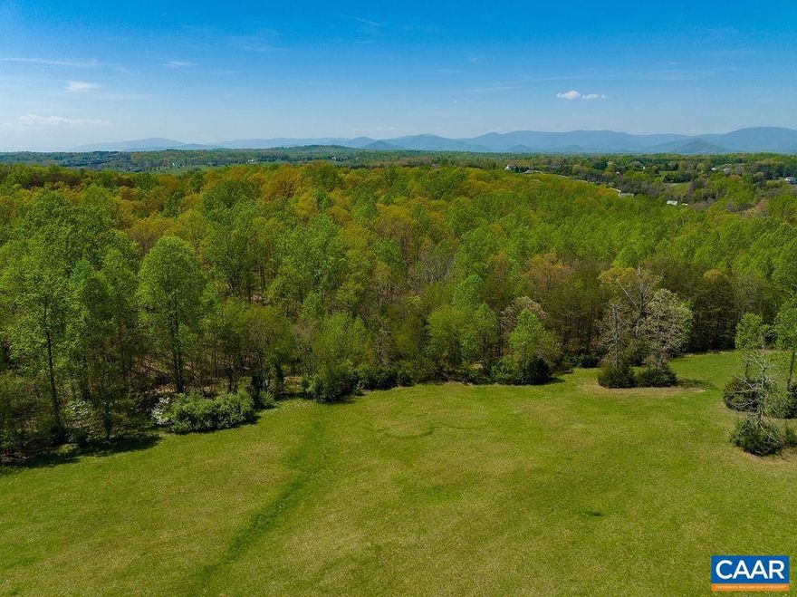 Beautiful elevated 4.55 acre building parcel located in beautiful Northern Albemarle County. This parcel offers an open elevated building site with gorgeous views of the Blue Ridge Mountains and surrounding mountainside.  Located on a quiet country lane yet close to both Charlottesville and Ruckersville.  One of 6 parcels available in this small country subdivision; parcels range from 4 to 8 acres. Owner is working on building driveway entrances installed. It is advised to use 4wheel drive to access the parcels until drives can be completed.