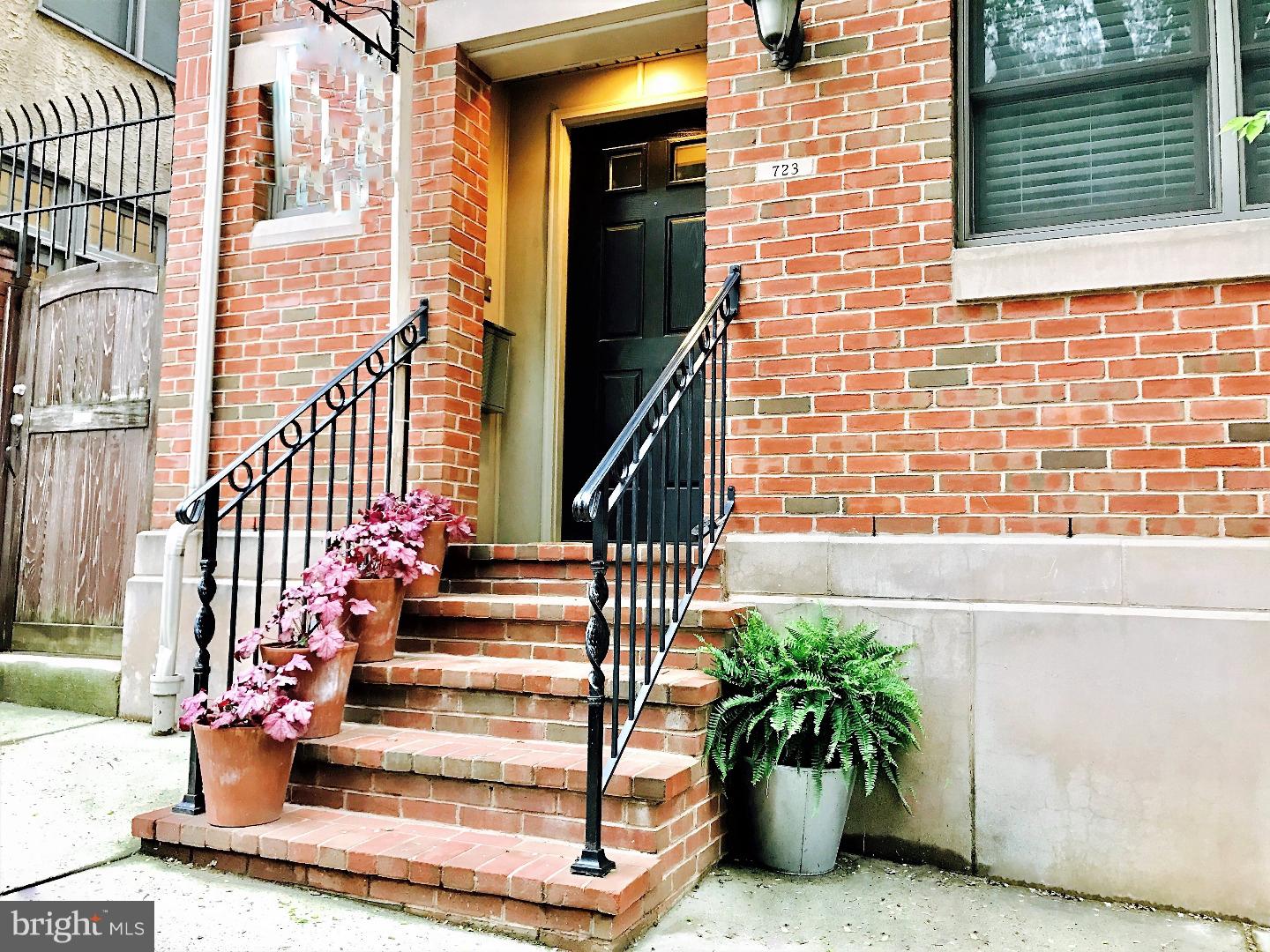 Located in the true heart of the Fairmount/Art Museum area, this custom built home offers city living at its very best. A rarity in Fairmount, this unique, extra wide, stand-alone town home features PARKING in your very own attached, 1-car garage. The complete package includes every modern amenity as well as 4 bedrooms, 3 1/2 baths, exotic, solid hardwood floors and 9ft ceilings throughout. Because this is an end unit/stand-alone home, there are tons of windows and the living spaces are flooded with natural light; truly stunning on a sunny day. The first floor features a large open plan living/dining space and a sleek custom kitchen with quartz counters, cherry cabinets, stainless steel gas appliances, island with seating and prep sink. The main level also provides access to the one car garage and to a convenient side yard area perfect for your BBQ grill and cafe table. The second floor offers 3 spacious bedrooms with ample closet space, full bath and upper level laundry area. The entire third level encompasses the very spacious and relaxing owners suite with an enormous his and hers walk-in closet, palatial spa-like bath with double vanities, separate shower, jetted tub, and a large deck featuring skyline views. Finally, the fully finished lower level has 10 ft. ceilings, recessed lighting and large windows for natural light. This level makes the ideal family room or in-law suite and includes a full bath, utility room with a second set of W/D hook-ups and ample storage. Best of all is the location, location, location! Within a few blocks walking distance, you'll find an unbeatable mix of world class museums and attractions, excellent eateries, Fairmount Park and every convenience. Walk one block to 4th of July fireworks and enjoy a myriad of festivals and events on the Parkway. Here, you're in the middle of the best Philly has to offer, but away from the hectic hustle and bustle. A true urban oasis. Come see for yourself. NOTE: The tax assessment for 2019 is actually LOWER than 2018.  Current taxes for 2019 are $8,575.34 WITHOUT a Homestead Exemption.  With a Homestead Exemption, taxes for 2019 would be approx $8,045.  Please check the OPA website for details.