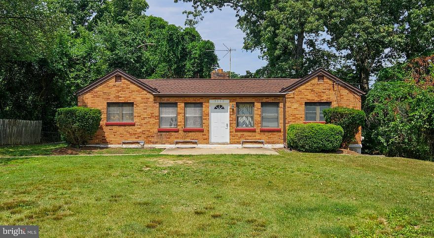 Large rambler with lots of potential in need of renovation. Property is being sold as-is.  Main level features a large living area, kitchen, four bedrooms, and a full bathroom. Basement features two additional rooms, a full bathroom, utility closet, and a large laundry room with exterior access. The house sits on a large lot and the driveway offers plenty of parking.