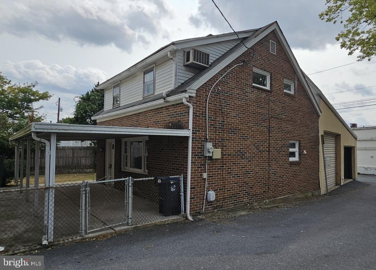 Unique Multi-Use Property! This versatile opportunity includes a 1,350 sq. ft. residence plus a 3-bay commercial shop/garage, all situated on two convenient alley frontages. The home features 2 bedrooms, 1 full bath, a spacious living room, dining area, and kitchen. A small fenced yard and large patio provide outdoor space, with potential to convert the patio into a carport (buyer to verify). While there is currently no on-site parking, the commercial shop offers excellent potential for a business that does not require customer waiting areas. Perfect for investors or owner-occupants seeking income potential—live in the home and lease the shop, or utilize both for personal use. A rare chance to own a property with flexible residential and commercial possibilities!