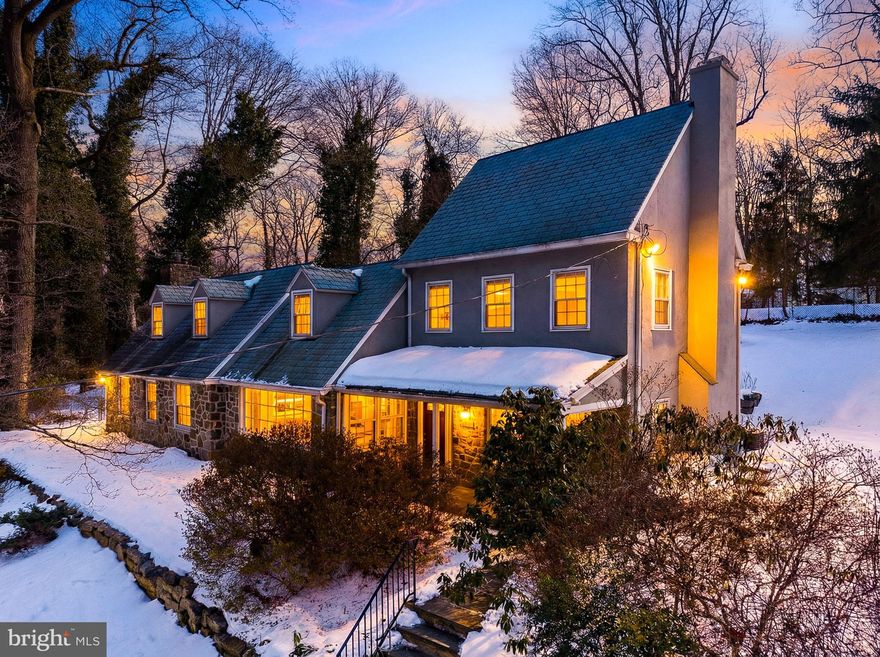 Set back from Bryn Mawr Avenue and accessed via a private drive in coveted Lower Merion Township, 829 Bryn Mawr Avenue is a beautifully renovated 4-bedroom, 2.5-bath stone retreat offering the perfect balance of privacy and convenience in Penn Valley. Nestled on nearly ¾ of an acre surrounded by mature trees and lush greenery, this home feels tucked away in nature—yet remains walkable to Narberth and local favorites.
The classic Main Line stone façade, slate-style roof, and softly glowing windows create an inviting first impression. A covered flagstone front porch welcomes you home—an ideal setting for morning coffee or greeting guests—while the elevated positioning enhances both privacy and architectural presence.
Upon entering, you are greeted by a gracious foyer with the formal dining room to the left and an elegant living room with a fireplace to the right, creating a timeless and balanced layout. The dining room is framed by a large picture window overlooking the greenery, while the formal living room offers warm hardwood floors and a beautiful fireplace focal point—perfect for intimate gatherings or quiet evenings at home.
Flowing seamlessly from the dining room, the fully renovated chef’s kitchen serves as the heart of the home. Featuring stunning white marble backsplashes and a dramatic wraparound island that comfortably seats eight, the kitchen opens to a spacious den with gas fireplace and main living area, creating an effortless connection between cooking, dining, and everyday living. Recessed lighting, generous counter space, and views of the surrounding trees make this space both functional and inviting. The kitchen also provides direct access to the expansive stone patio, blending indoor and outdoor living beautifully. A beautifully remodeled powder room and a convenient first-floor laundry area complete this level.
The terraced backyard feels like a private sanctuary with a large shed, anchored by a spacious stone patio perfect outdoor dining, or simply enjoying the peaceful, wooded setting.
Upstairs, the luxurious primary suite has been completely transformed into a spa-like retreat. The newly remodeled bathroom showcases exquisite Italian marble finishes, a floating vanity, LED mirror, and refined detailing rarely found at this price point. Additional bedrooms are generously sized and enhanced with newly refinished floors and plush carpeting, while two staircases and a wide upstairs hallway create easy, natural flow throughout the home.
A standout feature of the property is the detached two-car garage carriage house with a fully renovated studio above. Finished with new flooring, recessed lighting, and a mini-split system for year-round comfort, this flexible space is ideal as a private home office, in-law or au pair suite, fitness studio, or creative workspace.
Extensive recent improvements include a complete kitchen renovation in 2025, a primary bath remodel with Italian marble finishes, a full carriage house studio renovation in 2025, powder room remodeling with marble tile, whole-house repainting, upstairs floor refinishing and new carpeting, and the installation of a new LG washer and dryer. The slate-style roof offers over 20 years of remaining life, and the home is heated by an efficient central hot water radiator system and cooled with dual-zone air conditioning.
Located in a rare Lower Merion School District high school choice area—allowing attendance at either Harriton or Lower Merion High School, both National Blue Ribbon Schools of Excellence—with school bus stops at the end of the driveway for elementary through high school. The finished lower level provides additional flexible living space, ideal for a media room, playroom, gym, or recreation area.
Private yet connected, timeless yet thoughtfully renovated. At 829 Bryn Mawr Avenue you’ll enjoy the perfect balance of privacy and convenience in one of Penn Valley’s most desirable settings.