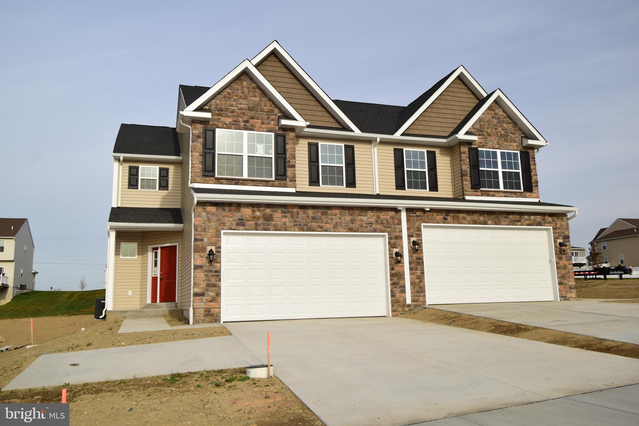 5.375% SPECIAL PROMOTION FOR THIS COMPLETED DURHAM MODEL ON LOT 112! Take advantage of the Builder's locked in 5.375% interest rate and move right in to this beautiful home! The spacious design of the Durham includes over 1,800 square feet of living space! Starting with the unique private/angled entry and covered porch, you're immediately drawn into the living room, with easy access to the two-car garage and first floor powder room. Quickly store coats, shoes, or spare linens in the linen closet as well. Beyond the living room is the dining room with tray ceiling that is open to the kitchen, providing an air of open living, yet separated by a knee-wall; perfect for additional decorating space! The L-shaped kitchen includes ample quartz counterspace, including an island with an elevated overhang and accented with a lovely tile backsplash! Just up the split staircase is a full bath with linen closet, and two spare bedrooms, each with large closets. At the end of the hall is a laundry closet that will ensure laundry is an easy task. Finishing off the Durham is a lovely master bedroom featuring a sitting area, walk-in closet, and en-suite bathroom with a double vanity, and shower.