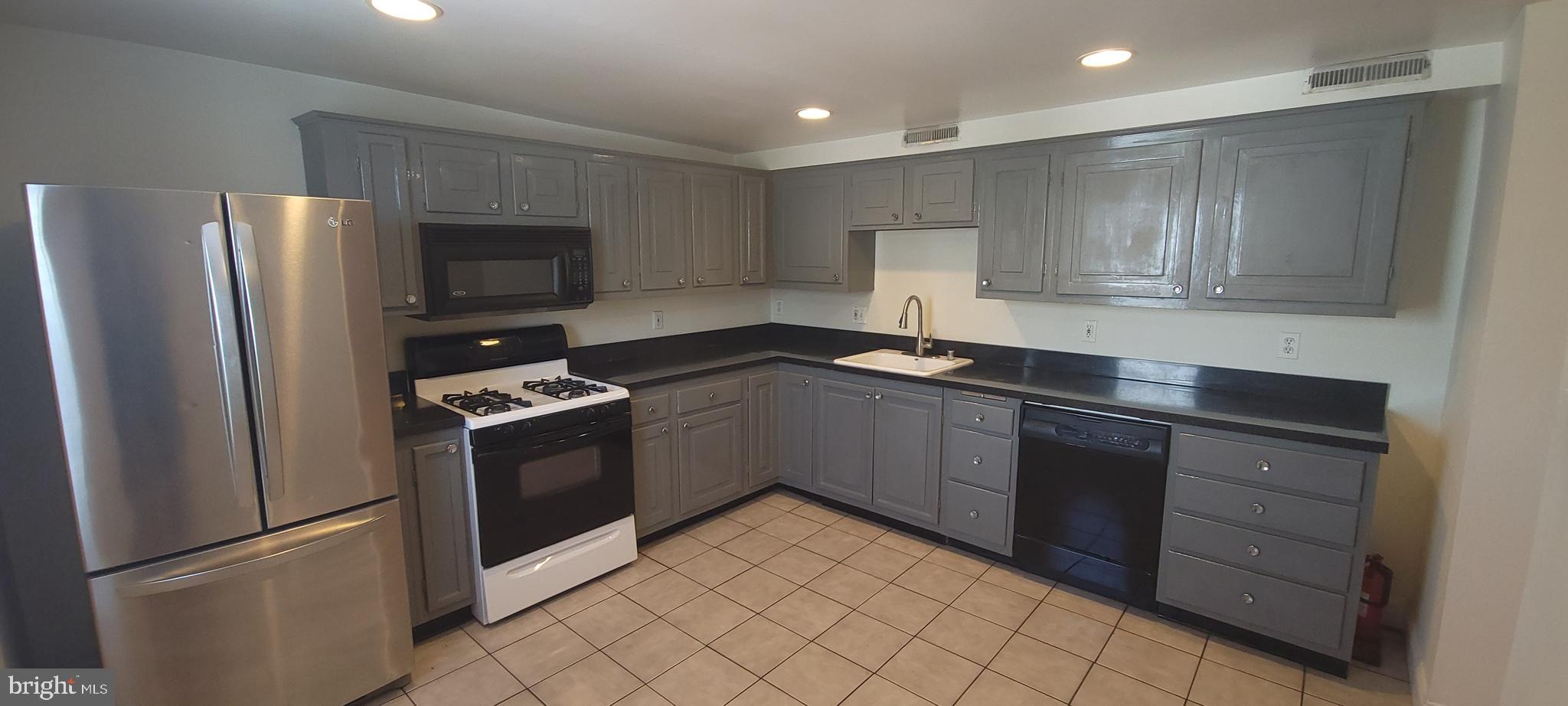 This two story apartment features 3 extra large bedrooms and 2 full bathrooms with 2 CAR PARKING AVAILABLE. A newly renovated second floor bathroom, exposed brick throughout, CAC, modern large eat in kitchen, DW, microwave, W/W carpeting and stack front loading washer/dryer in unit. House comes with 2 CAR PARKING that can be rented for an additional $100/month if interested!!! This property is located in the heart of Locust Point and provides easy access to all the city living features you love!!. Latrobe Park is 2 blocks away, walk to restaurants, bars, Under Amour, Ft Mchenry, Charm City Circulator & Commuter water taxi ,Federal Hill, Harris Teeter shopping center all close by! Sorry No pets/smoking allowed. Max of 3 occupants for this unit Ask about Sept move in special!!