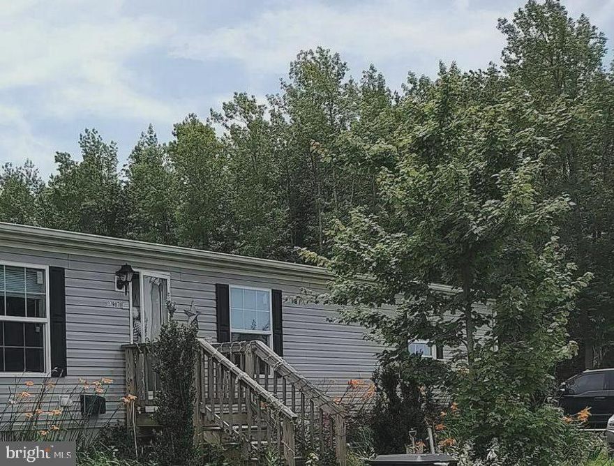 Nice home sitting on 3.77 acres with room to grow or start a mini farm with horses and plenty of places to ride. The home features an open floor plan with a living room and family room that are just off the kitchen for entertaining family or friends. The home also has four bedrooms and two full baths. There is a sliding glass door in the family room for the kids to go out and have fun. There is also a horse barn already on the property and a one car detached garage.  Come and take a look at the potential this property has to offer! Agents and potential buyer's to verify all property and school information to your satisfaction.