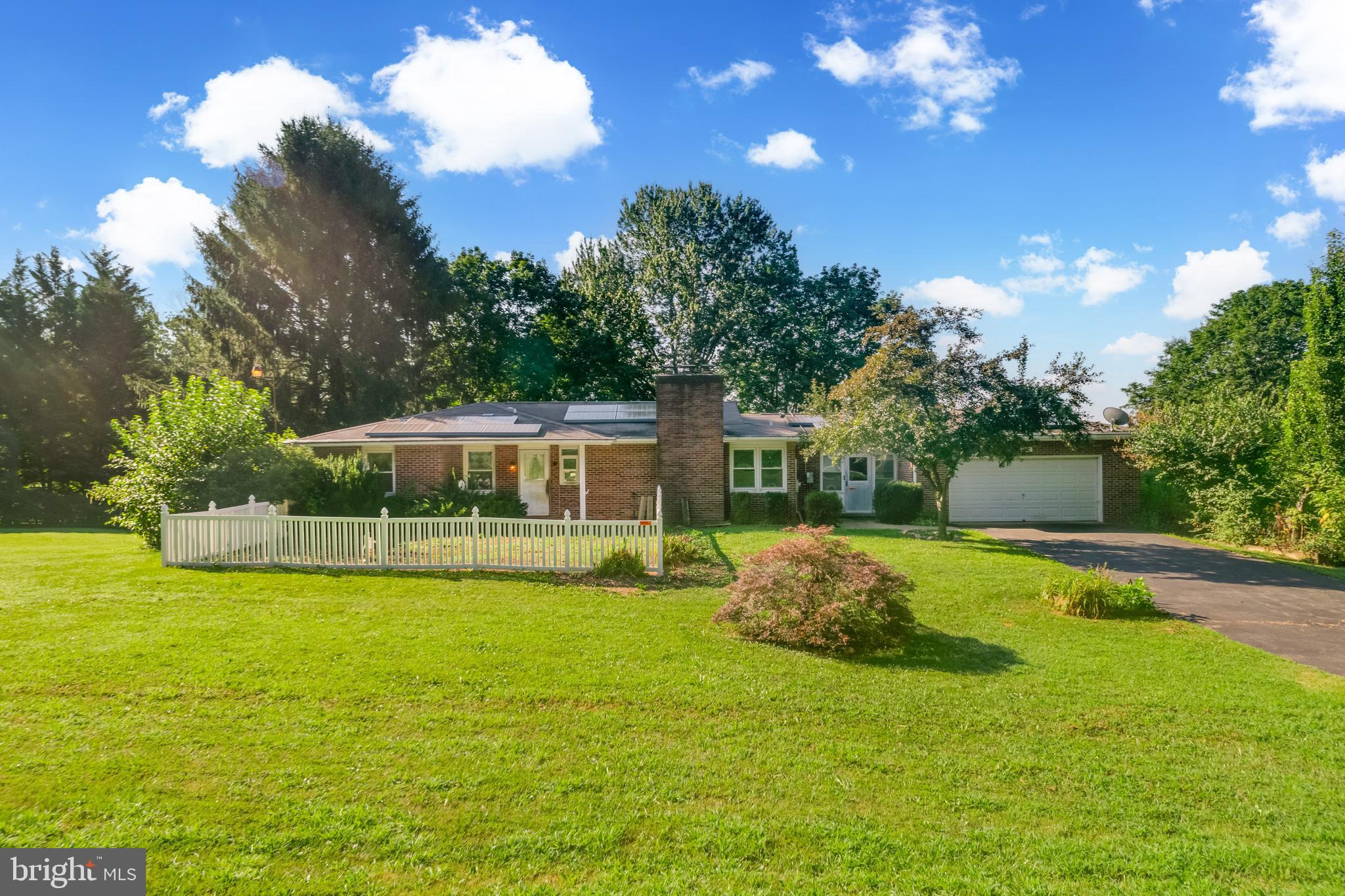 PRICE IMPROVEMENT - Welcome to this charming 3-bedroom, 3.5-bath brick ranch situated on a spacious 1.16-acre corner lot. With generous indoor and outdoor spaces, this property offers comfort, functionality, and room to grow.
The main level features a spacious layout, complemented by a large enclosed breezeway that connects the home to the attached garage—ideal as a mudroom or casual greeting space that leads you to both the main house and a large, enclosed porch overlooking the expansive back yard. The 2 car garage is outfitted with floor-to-ceiling cabinetry for exceptional storage and organization.
The walkout basement includes a partially finished area perfect for additional living space, along with a lower-level garage that offers ample room for storage or a workshop setup—great for DIY projects or hobbies.
Outdoors, you’ll find a blacktop driveway, a fully fenced backyard with both privacy and split-rail sections, and a shed for extra storage. Whether you’re relaxing or entertaining, the yard offers both openness and structure. A smaller upper-level fenced area adds another layer of versatility to the outdoor space.
Additional features include a full-house generator, a whole-home water conditioning system, and solar panels installed in 2017 to boost energy efficiency.
This solid, well-equipped home is part of an ESTATE and BEING SOLD "AS IS" while offering lots of possibilities to make it your own through personalized updates and improvements.