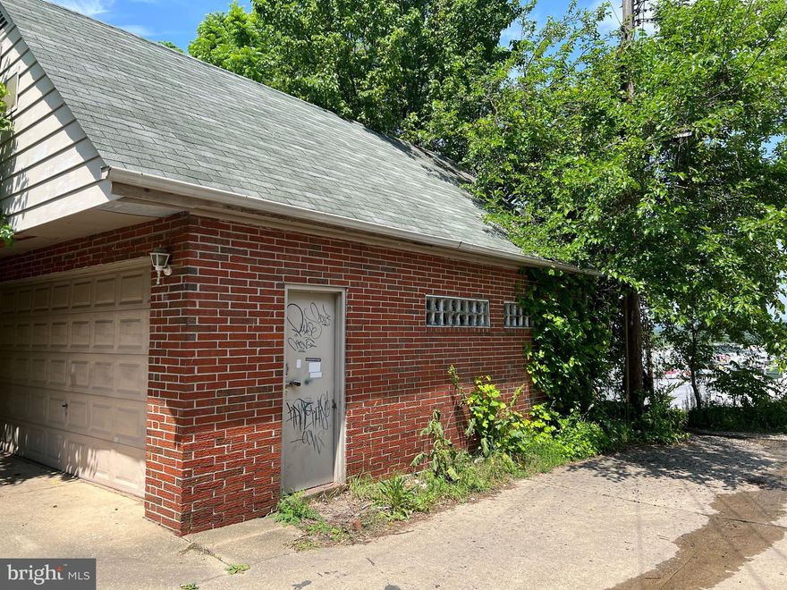 Unique 2 car garage or storage opportunity located close to Home Depot and major road- ways. The property is overgrown but the lot is 0.20 ac and is ideal for a contractor, or investor looking for rental income. There is electric however, buyer to verify condition. No water or sewer. The upper area offers additional storage, total building is 540 sf-est. Zoning is residential, buyer to verify potential usage. AS IS SALE, NOTE DISCLOSURES