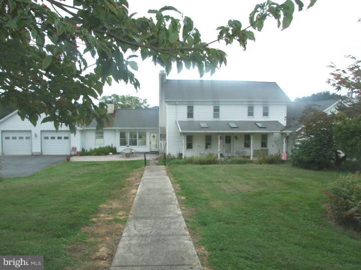 Quaint farm with farmhouse & buildings situated in an idealic valley setting with rolling farmland and stream views. Turn of the century farmhouse which has been well maintained with recent upgrades including beautiful kitchen with custom cabinetry and granite countertops. First floor owners suite with adjoining tile bath and walk-in closet. Large Family Room with woodstove, cathedral ceilings & hardwood floors. Original house has a special character to it. The grounds are mostly tillable with a stream running through. Outbuildings include a 2 story bank barn, a 100'X75' machine shed with 18' overhang and a shed/stable. Wonderful Property! Property includes 8-1 acre building lots which have been subdivided and approved.