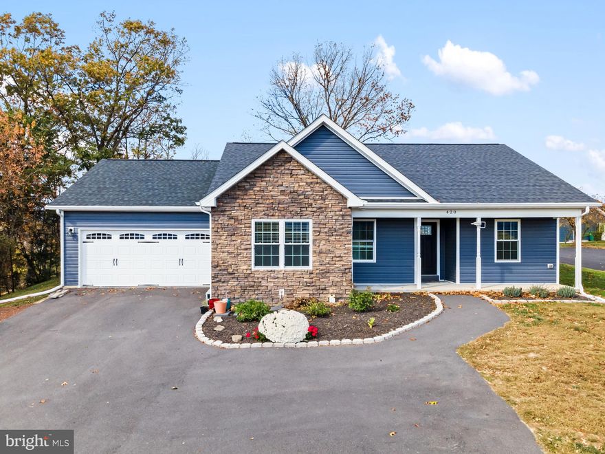 Welcome home to this beautifully built 2023 residence in Woodstock, VA, where modern comfort meets stunning mountain views. Just a short distance to the W.O. Riley Park, this home offers the perfect blend of convenience and peaceful living. Set on nearly half an acre, you’ll love the ease of one-level living featuring 3 bedrooms and 2 full baths. The open layout is bright and welcoming, showcasing a stylish kitchen with granite countertops, stainless steel appliances, and quality finishes throughout. Cozy up by the pellet stove on cool evenings or step outside to enjoy your covered back porch — a perfect spot to relax and take in the view. The exterior’s mix of stonework and vinyl gives this home wonderful curb appeal, while the paved driveway and spacious two-car garage add everyday convenience. Ideally located close to Downtown Woodstock, I-81, and all the local amenities, this home has it all — comfort, style, and a great location!