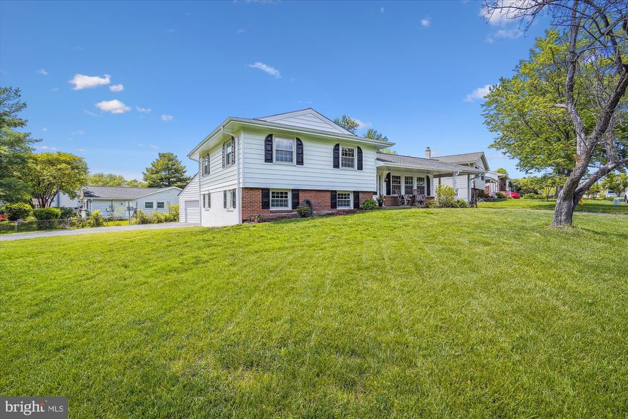 NEW roof, NEW gutters, NEW siding and NEW carpet  This super value is one you have waited for! This spacious home is updated and freshly painted, ready to move in.  The heart of the home is the big, beautiful Kitchen -  lots of storage in the dark wood cabinets, glossy granite countertops and SS appliances.  The sunny eating area is perfect for family gatherings and has side access to the yard and carport.  The Main level enjoys an open floor plan - Living Room leading to formal Dining Room -  both with new neutral carpet. Three Bedrooms, all with NEW Carpet, plus two Full Baths are on the upper level.  A few steps down to the generously sized Family Room  - bright and cheerful with a wall of extra storage and lots of windows. This lower level includes the 3rd Full Bath, Laundry Room with newer appliances and Office space or area for Bedroom #4.  Walk out to the Garage - any man's dream! This Garage is oversized for 2 cars PLUS an additional attic space for storage or hobbies. Imagine, double driveways for family and guest parking!  A split rail fence enhances the charming curb appeal. Don't wait on this one!
