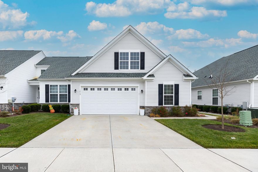 Superb. newer carriage style home located in the ever popular active adult community of Whispering Woods!!  Oversized great room with recessed lighting, gas fireplace and luxury vinyl plank flooring, gourmet kitchen w/granite countertops, stainless steel appliances, island and separate eating area, owners suite with coffered ceiling, ceiling fans, sitting area and oversized walk-in closet and more!!  Outside enjoy the private screened porch with ceiling fan and paver patio!!  Two car garage!!!  Community amenities are countless with the pool, clubhouse, pickleball, themed events and more!!  Don't miss this gem!!