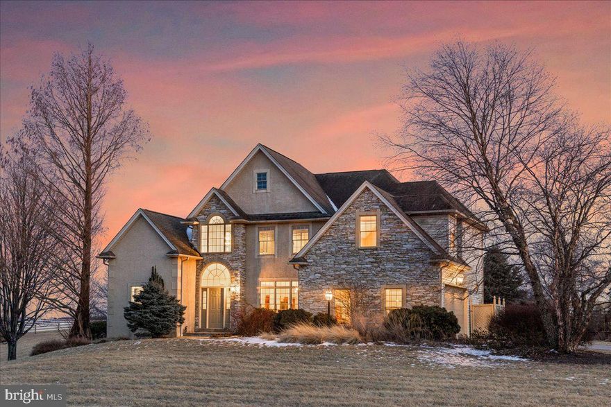 A premier equestrian estate designed for seamless business operations, this property offers state-of-the-art facilities and a thoughtfully crafted residence, set against a backdrop of rolling pastures. The Monogram custom home spans 3,589 sf, with an additional 1,000-sf finished lower level. A great room with a cathedral ceiling and fireplace sets the stage for effortless entertaining, while the gourmet kitchen, formal dining room, and library provide refined spaces for both work and leisure. Beyond the residence, the estate is purpose-built for equestrian excellence. The stables feature 15 12’x12’ matted stalls, heated wash stall, utility/laundry room, an attached 40’ x 30’ breeding area that could be converted into add. stalls. A FURNISHED 800 sf APARTMENT above the barn provides comfortable accommodations for staff or guests, while a dedicated 20'x16’ office ensures smooth business operations. Nearby, a 40’ x 60’ hay and equipment building offers ample storage. Training facilities include a 70’x160’ indoor w premium fiber footing, shatterproof mirrors, and ventilation panels for summer airflow, as well as an 80’x200’ outdoor arena with sand footing, a ringside gazebo, and a 60’ round pen. Carefully planned turnout options include 5 large dry lots, each with southern-facing loafing sheds and heated automatic waterers, as well as multiple paddocks and grass pastures. The entire property is fenced with durable white Centaur fencing, ensuring both safety and aesthetic appeal.