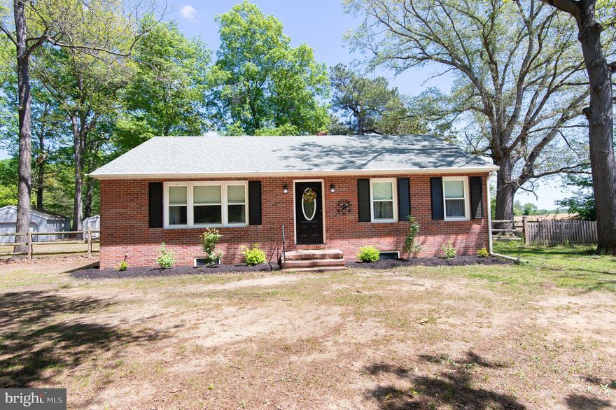 Looking for room to breathe and space for your projects? This charming brick rancher offers exactly that! Over 3 acres close to Preston, Easton and all mid-shore locations. The home features hardwood floors, updated kitchen, drywalled ceilings, new lighting and a new HVAC system providing heat and air.  The full basement offers room to expand and more living space. Fantastic yard - mostly fenced.  Shed and garage both have electric.  The garden is already planted - enjoy fresh fruit and vegetables all summer long!
