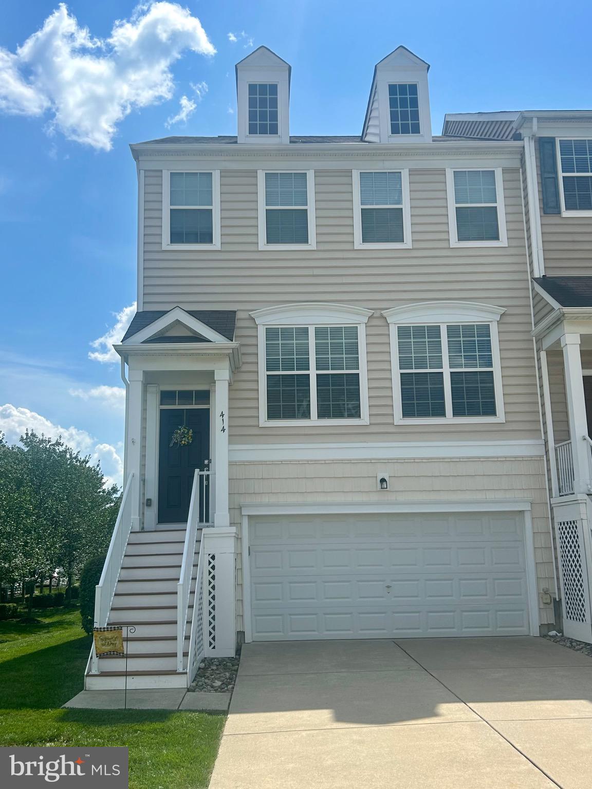 Beautiful end unit townhouse in desirable Montgomery Pointe. Enter the main floor to a grand staircase leading to wonderfully lit white kitchen with quartz countertops. Hardwood floors grace this level along with wainscoting, gas fireplace, powder room, cozy living room and dining area with windows galore. There is also a door leading to private trex deck for your entertaining purposes. Upstairs graced with new carpeting, you will find the owners suite with large luxury bath, double shower and double vanities. Fabulous walk in closet finish the en suite. Two other bedrooms and hall bath complete the second floor. Lastly, head downstairs with the newly carpeted stairs and den. There is a large laundry room and two car garage to make this home a true gem. Neighborhood playground, pickle ball courts and convenience to major shopping and roadways just add to the perfect home. Showings will begin on August 2nd and we cannot accommodate anything earlier. Monday - Thursday showings after 3:00pm and Fri, Sat and Sun after 9:00am