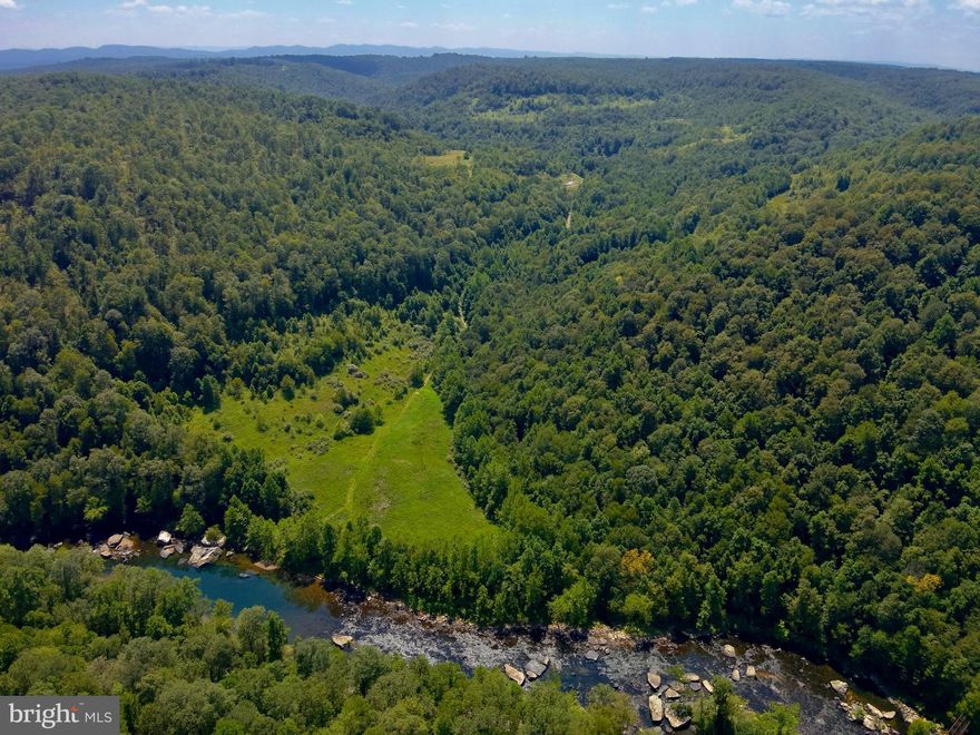 Secluded 329 ACRE Tygart Riverfront Paradise with Mineral Rights & Marketable Timber! Welcome to your own slice of heaven! Nestled among the rolling hills and serene valleys, this magnificent property offers an unparalleled opportunity for nature enthusiasts and outdoor adventurers alike. With sellers conveying their mineral rights, the potential of this land extends well beyond its breathtaking beauty. With 800 +/- feet of Tygart River frontage, this property is a paradise for anglers, kayakers, and rafters. Imagine spending sunny afternoons fishing for smallmouth bass and musky. This land is not just a haven for recreation, it also boasts an abundance of marketable timber, offering both beauty and potential income. Explore your expansive property with well-maintained interior roads, suitable for all types of vehicles or ATV's. Just minutes away from Audra State Park, you’ll find an abundance of outdoor activities including hiking, camping, and wildlife observation. The nearby state-stocked trout streams provide additional fishing opportunities, while Tygart Lake offers boating and swimming for those sunny days. This property is a retreat from the hustle and bustle of daily life. Surrounded by nature’s beauty and enhanced by multiple ridges and valleys, it provides a sense of peace and privacy that is increasingly rare in today’s world. Despite its secluded feel, this gem is conveniently located near Elkins, Stonewall Jackson Resort, and Clarksburg Regional Airport, making travel and access to amenities a breeze for both residents and guests. Whether you're looking to build your dream home, create a retreat, or invest in a lucrative piece of land with mineral & timber potential, this property offers it all. Experience the ultimate blend of tranquility, adventure, and opportunity.