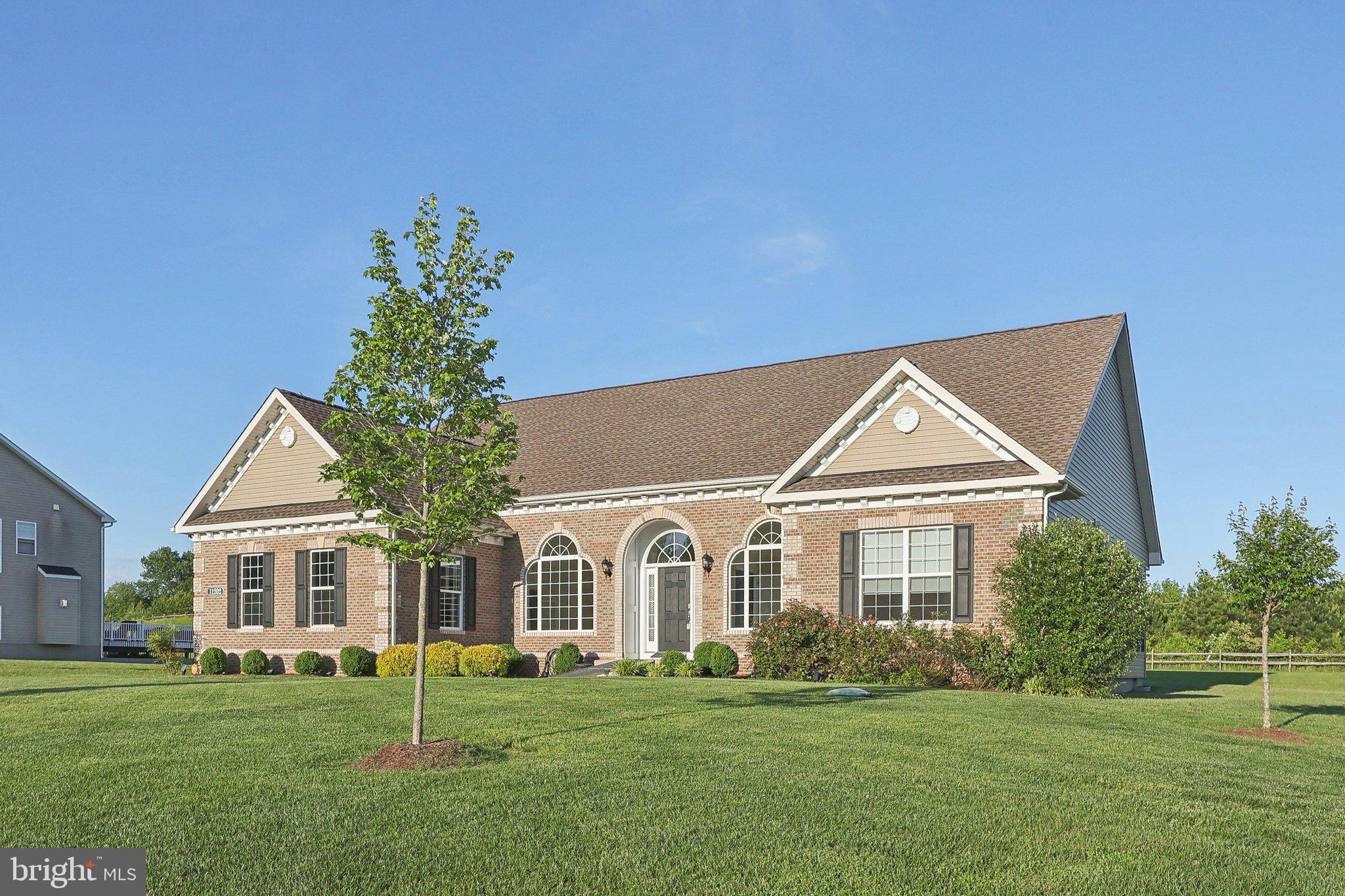 Welcome home! This beautifully upgraded, single-level residence offers effortless living in a prime location—perfect for commuting to DC, Virginia, and nearby military bases. Enjoy the light-filled morning room and a sunny four-season room that invite relaxation and comfort. The stylish primary suite features a ceiling fan with light and a stunning full bath finished in timeless style. The main floor includes shades on the windows for added privacy and comfort, while the family room also boasts a ceiling fan with light for year-round enjoyment. Step outside to a Trex grilling deck and an outdoor patio complete with a cozy fire pit and built-in sitting bench—ideal for entertaining or unwinding under the stars. The basement adds valuable bonus space for work, play, or entertainment. Built with quality craftsmanship by K & P Builders, this home is ready to impress its next owner! Pending release