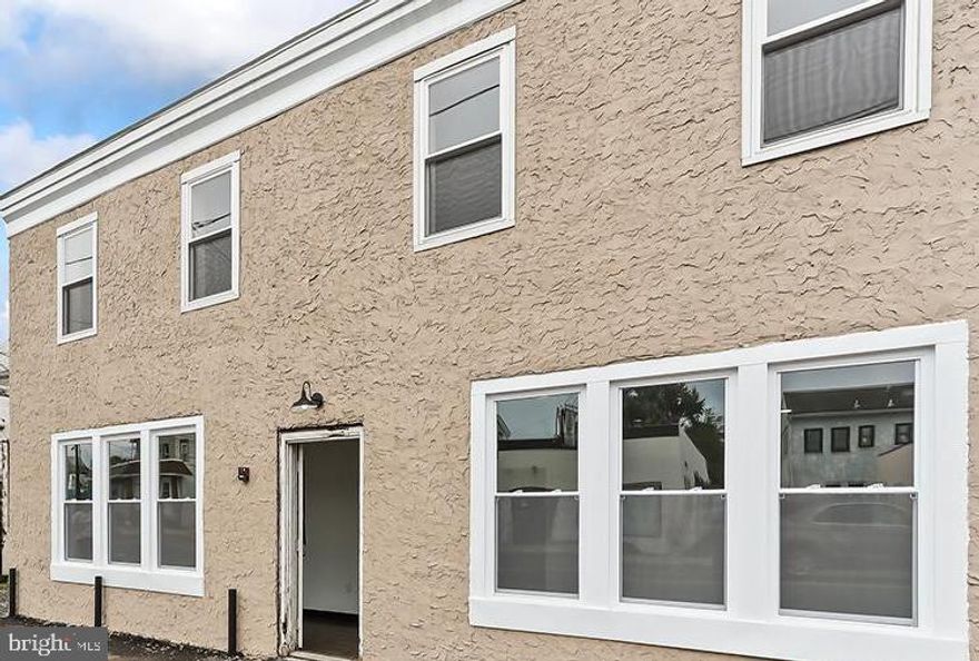 This property is completely turnkey and has already started generating income for you! We'll start with Store Front commercial space that offers parking in front of building. This space is a blank canvas for the new occupants equipped with a handicap accessible bathroom and its own mini split for heating and cooling. This commercial space has access to the basement which may allow for additional storage if needed, and easy to pre-fab plumbing/electric etc. for the new occupant.
 (One Lease in Place as of January 2025). 

4 Large residential units with rear entrance and private parking lot are located in the back of the building away from the street. All of the residential units offer eat- in Kitchens boasting solid wood white cabinets, upgraded granite counters with undermount sinks, timeless subway style backsplash, stainless steel appliances with one year manufacture warranty. Bathrooms have solid wood white cabinets and granite counters, tile and tubs, and fans. You'll find generous size bedrooms and lots of windows, plenty of closets for storage, wall to wall carpets in bedrooms, upgraded cork flooring that will sustain more wear and tear, recessed lighting throughout, individual in unit breaker panels, and individual HVAC units. Both downstairs units are mirror images of one another providing 2 bedrooms, 1.5 bathrooms, spacious living space and private decks 
( Both units One year leases in place as of January 2025). 

Both Upstairs units are mirror images of one another providing 2 bedrooms 1 bathroom on the main floor and third bedroom/ loft space is on the third floor of the building. (Currently in process of renting).**** Update as of June 2025- 2 year lease in place, currently in process of renting final unit. 

Centrally located in a very desirable Neshaminy school district, and within walking distance to Cairn University Campus, as well as the commuter Langhorne train station, and nearby shops, restaurants, nightlife, markets, laundry mats, corner stores, and post office. The entire building was rebuilt from the foundation up, all new electric, plumbing, HVAC, electric meters, insulation, sheetrock, waterproofing in basement, sump pumps roof, exterior, rear parking lot, windows- you name it! All permits in place and approvals for review.