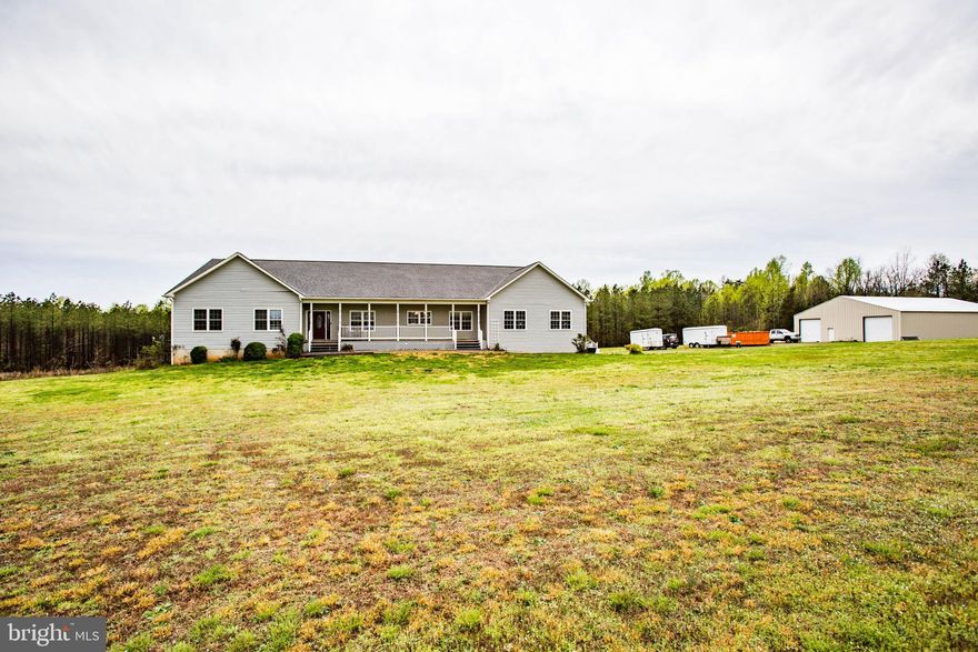 Welcome Home to this custom built 3900+ sq.ft. Rambler located on over 24 acres. This well-maintained home offers a total of 6 possible Bedrooms or 3 Large Bedrooms with an additional 2 Master Bedroom Suites.  This is a split bedroom floorplan with 3 Large Bedrooms & a large master bedroom located on one side of the main living area and, either a Master Bedroom with Separate Attached Sitting area, or two separate bedrooms on the other side of the main area. You get to choose how this home will best meet your needs. There is room for everyone.  The gleaming hardwoods and fresh paint make this home bright & cheery year-round. The over-sized kitchen has upgraded stainless appliances, granite counters and a large area for your kitchen table to fit as well.  A full unfinished walk-out basement is just waiting for you to make it yours.  The basement is light filled and offers multiple outside entry doors to your large, open rear yard.  There is a supersized detached shed/garage that measures 50  x 75  that provides you with tons of additional options.  A fully covered front porch, large rear screened porch, rear patio, wood deck plus almost 3 acres of buried electric dog fence help complete the picture.  A New Water Treatment System ($7000) was recently installed as well.  Your private paradise is waiting for you!  CHECK DOCUMENTS FOR FULL FLOORPLAN.