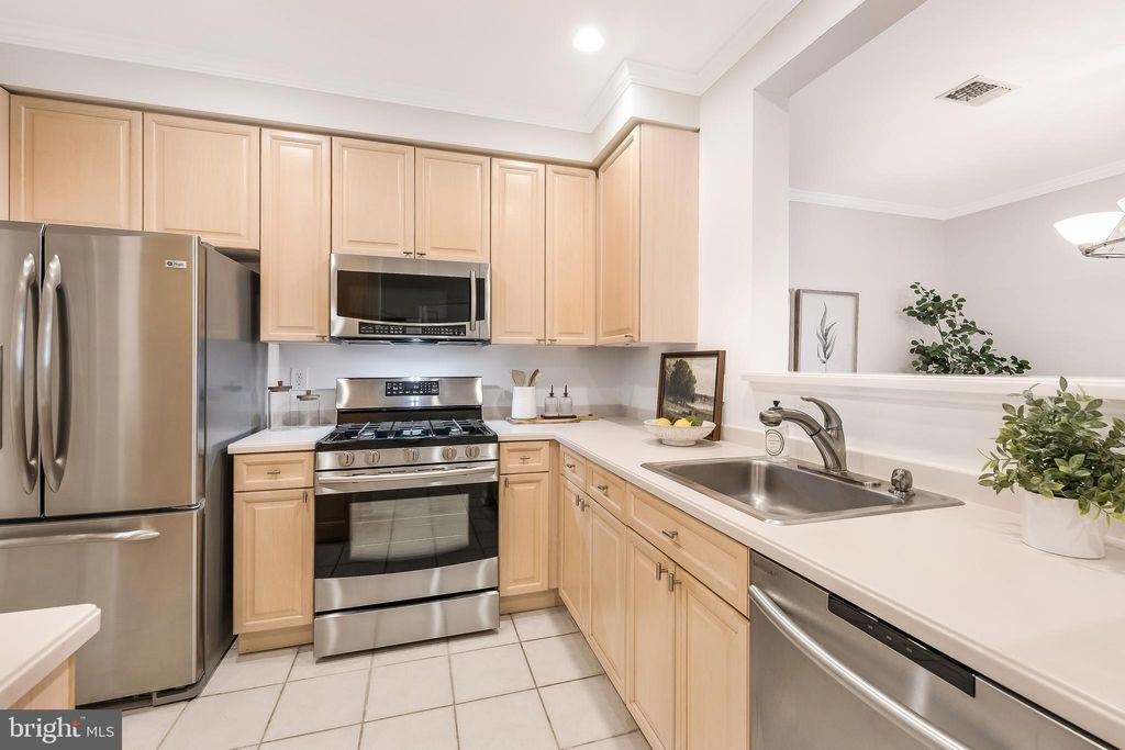 Photo of 1855 Stratford Park Place #303, RESTON, VA 20190 (MLS # VAFX2264912)