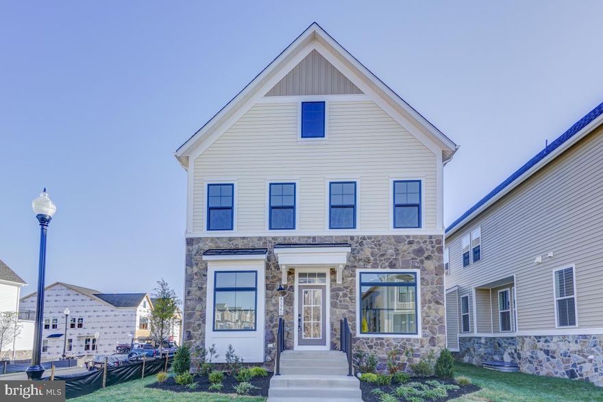 Stunning New Construction (2022) barely been lived-in Van Metre Single Family Home is ready for move-in, why wait 9 months to build a home when you can move in to a brand new home immediately**This 4 Bedroom. 3.5 Bath home has over 4000 Sq Ft with high end finishes throughout**Stunning, meticulously maintained brick front Modern Colonial style home in the heart of coveted Brambleton! ** This Gorgeous Tyler w/ 8 ft extension model is Built by Van Metre in 2022 and boasting one of the best Lots in Brambleton, this spectacular home is an end-unit offering more privacy than most in the neighborhood! This lovely home is just minutes from Brambleton Town Center and schools**HOA fee includes Verizon Fios Internet & cable** Featuring 5 bedrooms, 4.5 baths, and a main level Study, this open concept home has amazing curb appeal, including a partial stacked stone wall exterior and extra space between the neighboring homes. Filled with natural light throughout and countless upgrades to include gleaming wide luxury vinyl plank thru-out the main level, a whole-house humidifier, 2nd-floor laundry unit option, upgraded carpet/padding, lots of recessed lighting, and trendy fixtures, this home has it all! The gourmet kitchen with extended quartz countertops, soft close modern white cabinets, stainless steel appliances, commercial grade hood which vents out and a custom herringbone tiled backsplash is gorgeous. The expansive family room invites you to cozy up by the gas fireplace or entertain large groups of friends and family. From the dining room, step outside onto your stunning large family for more entertainment space, in addition to the mud room on back. On the upper level, you will find four bedrooms and three full bathrooms, the master bedroom features a tray ceiling and has 8 foot extension, the primary bath is**spectacular** with double vanities, a soaking tub, and a framed glass shower. Bedroom 2 has an en-suite bathroom. Bedrooms 3 and 4 shares another full bath. The finished lower level features a spacious rec room and a possible 5th Bedroom, a full bath, and tons of storage to include a bonus space!! Extra large garage with plenty of of storage and plenty of street parking in front of the house**Premiere Loudoun county schooling district**short drive to ES ( Madison Trust), MS(Brambleton) and HS (Independence). Ample of common Area Parking**Walk to the schools, Pools & clubhouse**Enjoy outstanding Brambleton Amenities w/ Movie Theater, Restaurants, shopping, fitness center & state-of the art Library, walk to the 257 Acre State of the art Hal & Berni hanson park offers recreation,pools,sports courts,fields, fishing and more. Brambleton town center is minutes away dining, movies, coffee, groceries, doctors, health clubs. Enjoy 18 miles of paved trails , annual events, shopping , restaurants, airport, future metro and more