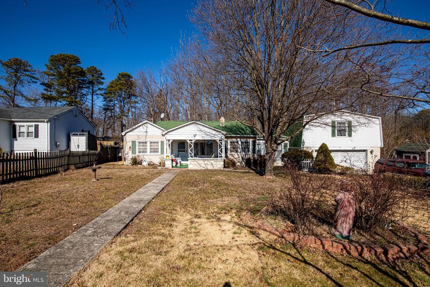 Great location in  established water oriented community with public boat ramp. 
Property consists of 5 lots on 2 separate tax records. Additional Lots unbuildable due to wetlands. 
tax id 11 1125045335 and 11 1125045336 are both included in the sale of 11222 Beach Ave.

Rancher with attached Garage with above apartment ALL in need of major rehab.  Apartment not currently accessible. 
Bring your plans and renovate or build the home of your dreams in this great water oriented community with in easy commute to Baltimore.

Property is being sold as part of an estate and is being sold  Strictly AS-IS. Not suitable for FHA financing.