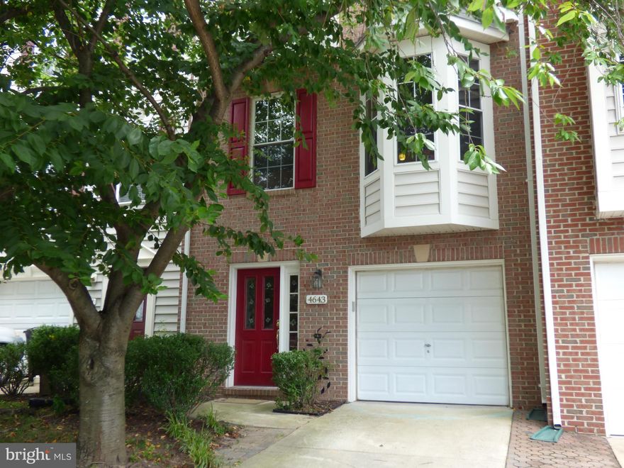 Perfectly updated townhome with garage  convenient for commuting/shopping. So much room in this fabulous open floor plan featuring gourmet kitchen, gorgeous hardwoods, living, dining and sunroom all on the main level. Nice deck for BBQ's too! Spacious master suite boasts walk in closet plus luxury renovated bath. Walk out basement rec room has cozy fireplace and leads to fenced in patio area.