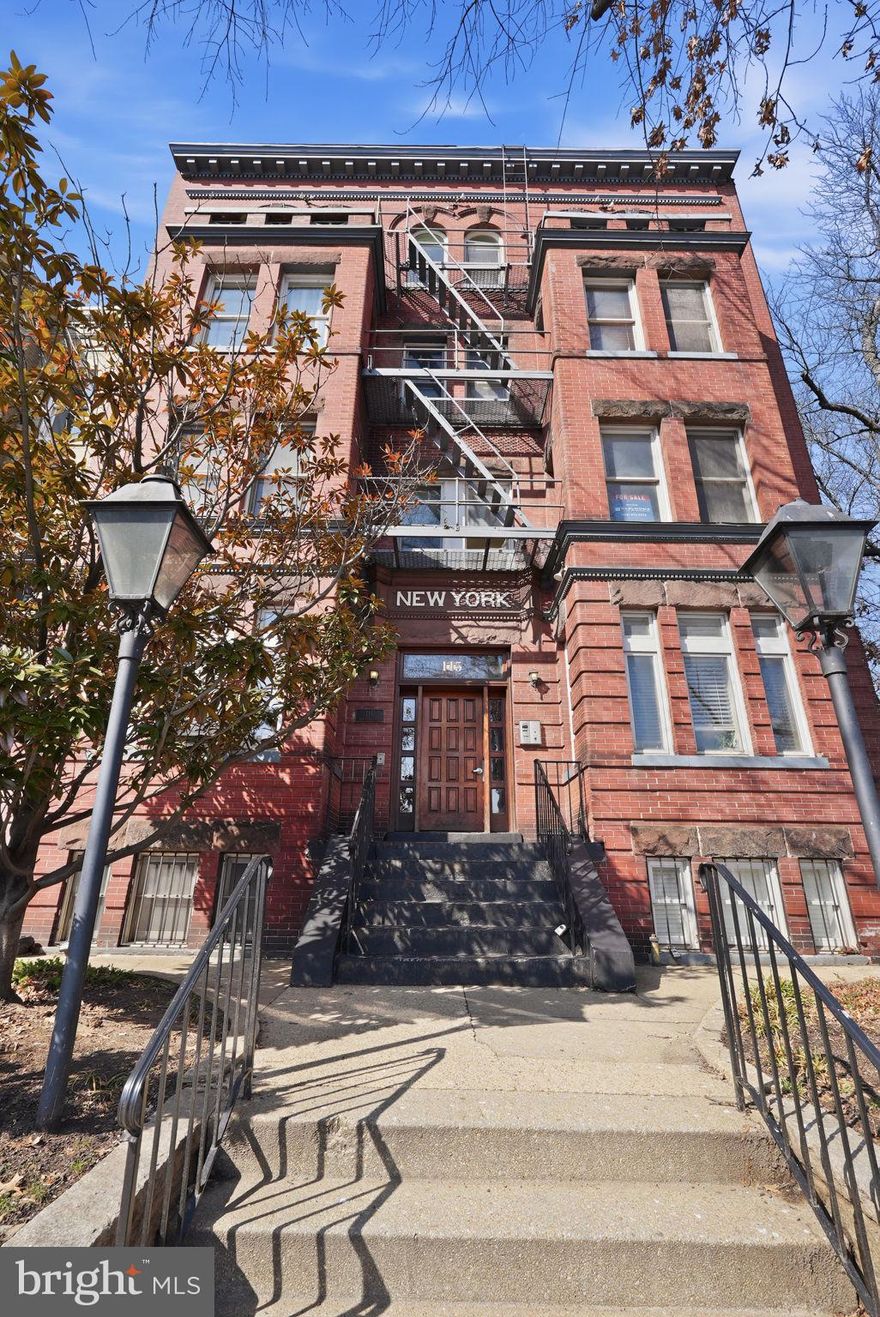 Why not have luxury at the heart of it all—for a fantastic value? I’m delighted to introduce you to 115 New York Ave NW #9 — a rare 2 bed 2.5 bath penthouse unit in a pre-war building offering a perfect blend of historic charm, fabulously modern upgrades, and a downtown location that puts all of DC within reach. Come with me as we explore the gorgeous open floor plan with exposed brick for living and dining, perfect for entertaining friends or for a quiet movie night in. The renovated gourmet kitchen includes quartz countertops with breakfast bar seating, custom cabinetry, and premium appliances—Sub-Zero refrigerator and wine cooler, Viking range, microwave, and vent hood. This is hands down the best price for what you’ll get with this kitchen. A half bathroom right off the living room is the perfect location while you’re hosting. The primary suite is your urban retreat — serene and spacious, it offers a custom fireplace, ensuite walk-in closet and gorgeous ensuite primary bath. Get ready to fall in love with staying in bed on Saturdays or run out to friends to see them at Big Bear Cafe, The Red Hen, Boundary Stone. Truxton Circle is at the heart of it all — Mt Vernon Square, NoMa, Chinatown, Shaw, Eckington, Bloomingdale, and mere minutes from Union Market. Parking is a breeze with your very own private gated parking spot right behind the building; daily drivers will love the easy access to New York Ave/Route 50/I-395 to get to where you need to be in less time. Half a mile to the red line at NoMa/Gallaudet, half a mile to the green and yellow lines at Mt Vernon/Convention Center, and walkable to Union Station with access to Amtrak/MARC/VRE and more... in this home, you are connected to the very heartbeat of the city. The second bedroom, complete with Murphy bed and extra storage, offers the perfect flex space for your home office, guests, or hobbies. Complete with an updated second full bath with a charming clawfoot tub, this condo has it all. Need a little breathing room? This condo has not one, not two, but three exterior spaces just waiting for you to enjoy. Look no further than your very own private balcony right off the living room with your own personal view of the Capitol and the Washington Monument. Start your day with a cup of coffee over bustling DC or wind down over drinks as you take it all in. Like the cherry on top of the sundae, you’ll enjoy lazy Saturday evenings on your expansive private rooftop deck that offers nothing but the very best of DC. Finally, a private storage and bike space at the very back of the unit offers you the storage you’ve been looking for. Pets are welcome in this building, with a sunny spot for the cat, a shady spot for the fish, and Bundy Dog Park, Althea Tanner Park, and NY Ave Playground right next door just waiting for the dog zoomies. This ultra-modern unit sits atop a gorgeous pre-war building that is listed as part of the Mount Vernon Historic District. Close to it all means close to the very pulse of the city   - the best restaurants, the highest-end shopping, and the easiest transportation. No need to settle for "out of the way," when you can live in the heart of it all and own a piece of the real, bustling city. Enjoy your own private urban getaway, where inside, you have all the privacy and seclusion of a quiet street in the suburbs - which a much better view - but you can feel the energy of the city right at the edge of your balcony, from above on your rooftop deck, and the moment you walk out your new front door. The best penthouse unit for a remarkable price awaits you!