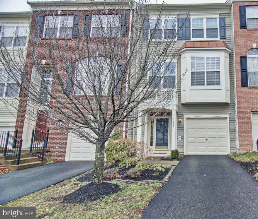 HERE IS THE ONE YOU HAVE BEEN WAITING FOR!!!! MOVE-IN READY UPDATED & UPGRADED TOWNHOME WITH OPTIONAL 3 LEVEL EXTENSION AND OVER 2,200 OF FINISHED SQUARE FEET. OPEN AND FLOWING FLOOR PLAN WITH TONS OF WINDOWS & NATURAL LIGHT....GREAT FOR ENTERTAINING!!! RECENT IMPROVEMENTS INCLUDE: NEW ROOF, NEW WATER HEATER, NEW GARAGE DOOR AND OPENER, PAINT, NUMEROUS REPLACEMENT WINDOWS & MUCH MORE!!! FEATURES INCLUDE: 9 FT CEILINGS ON ALL 3 LEVELS,  GLEAMING HARDWOODS ON MAIN LEVEL,  UPDATED GOURMET KITCHEN WITH ISLAND, SPACIOUS MASTER BEDROOM WITH WALK-IN CLOSET AND LUXURY BATH, HUGE REC ROOM WITH FIREPLACE AND WALK-OUT, OPTIONAL 4TH BATHROOM ROUGH-IN IN BASEMENT, GREAT DECK FOR ENTERTAINING & MORE!! BASIC CABLE AND HIGH SPEED INTERNET INCLUDED IN HOA FEE.  GREAT COMMUNITY AMENITIES INCLUDING MULTIPLE POOLS, TENNIS, BASKETBALL, VOLLEYBALL COURTS, WALKING TRAILS & MORE!!! EASY ACCESS TO 66, RTS 28 & 29, PRINCE WILLIAM PKWY, & VRE.  HURRY...THIS ONE WON'T LAST!!!