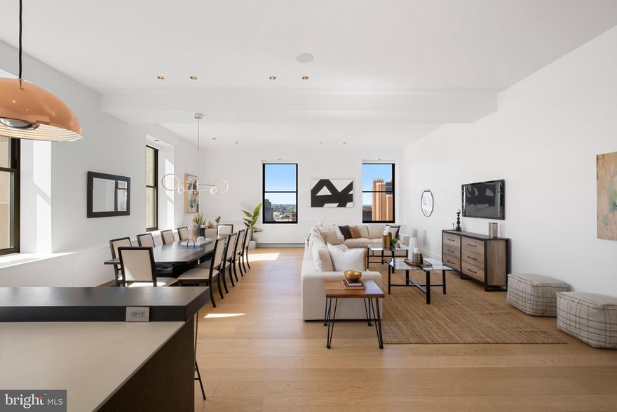 Welcome to the coveted Ayer Condominium, ideally situated off historic and pristine Washington Square Park. 12NW is a bright and airy home comprising of nearly 2,200 square feet and offers 2-bedrooms, 2.5-bathrooms with an additional den area, which has tremendous versatility and can be used as a home office or gym. Enter this home and the wow factor begins; a dramatic open concept living and dining area with nearly 12-foot ceilings, oversized windows flooding the room with natural light, European white oak hardwood floors, and a Crestron home automation system to control the lights, shades, and speakers. The kitchen, notably constructed with Bultaup cabinetry, is fully equipped with a Sub-zero and Miele appliance package and an oversized island with a breakfast bar. The large dining area is adjacent to the kitchen; perfect for entertaining a large dinner party of 10 or more. The primary suite is down the hall and has newly outfitted custom closets by closet works, Stark carpeting, and open city views. The spa-like bathroom was reconfigured to include a larger standing shower, make-up area, and upgraded double vanity with marble counter-tops. The second bedroom is generous in size with built-in shelving, plenty of storage space, and its own en-suite bath. The owners reconfigured this home to create an additional room, currently configured as a den and home office but can act as a gym or guest bedroom as well. The Ayer is a full-service condominium with a 24-hour doorman, concierge, fitness center, outdoor patio, and brand-new BMW chauffeur service. Note, 1 car parking is included in this sale, which is valeted by the buildings staff.