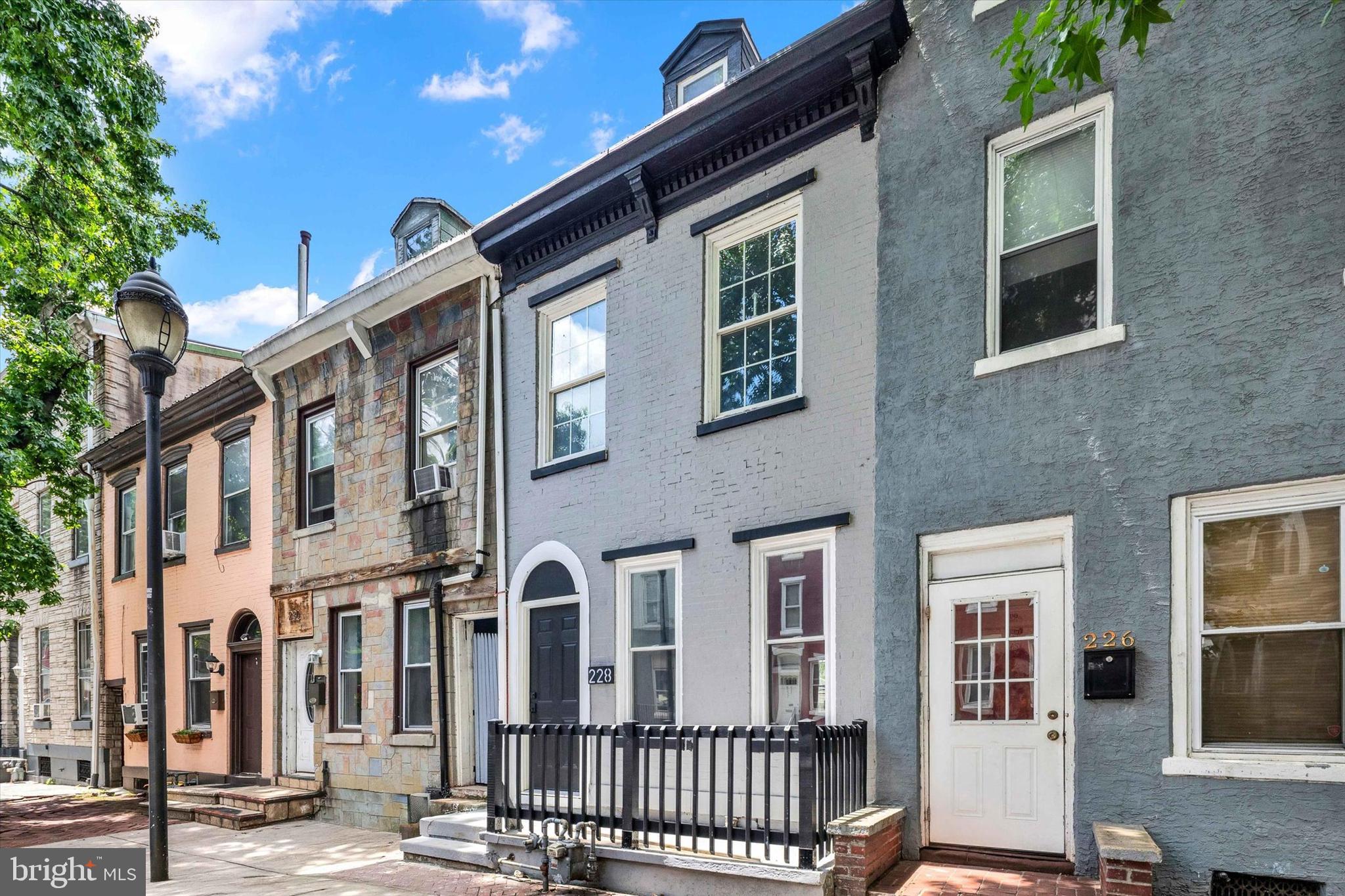 **Stop By the Open House on Saturday August 2nd from 2pm to 3pm** Welcome to 228 S 4th St, beautifully updated 5-bedroom, 2-full-bathroom home offering the perfect blend of charm and modern convenience. Boasting fairly high ceilings and recessed lighting throughout, this home feels bright, open, and inviting from the moment you walk in. The main level features a private bedroom and full bathroom—ideal for guests, multigenerational living, or a convenient home office setup; an eat in kitchen along with separate living room / family room areas. Upstairs, you'll find four additional private bedrooms, including a stylish sliding barn door that leads to the 5th bedroom on the third level. Enjoy cooking in the updated kitchen equipped with gas cooking, brand-new appliances, and a sleek design. The home has been thoughtfully upgraded from top to bottom, including a brand new natural gas water heater, electric heating, and more. Step outside to your long, deep fenced-in backyard—perfect for entertaining, gardening, or play. A covered rear patio area adds a great space for outdoor dining or relaxing in the shade. Don't miss your chance to see this in person and make this your new home! **Stop By the Open House on Saturday August 2nd from 2pm to 3pm**