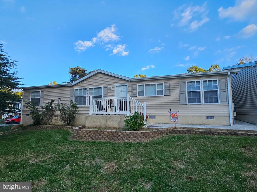 PLENTY of YARD with this 3-bedroom 2-bathroom Doublewide. This home has plenty of room with its three bedrooms, each having a walk-in closet, living room, kitchen and dining area. This very well-maintained home   would make a great first-time home or just your next home. The yard has enough room for the kids or your pets to run and play. The 2-car garage gives you a place for your autos or just a place to put your toys. Front road is county maintained leaving just the shared lane to be maintained. This home is less then 30 minutes from Martinsburg WV & I81. You have to visit this one to appreciate it.