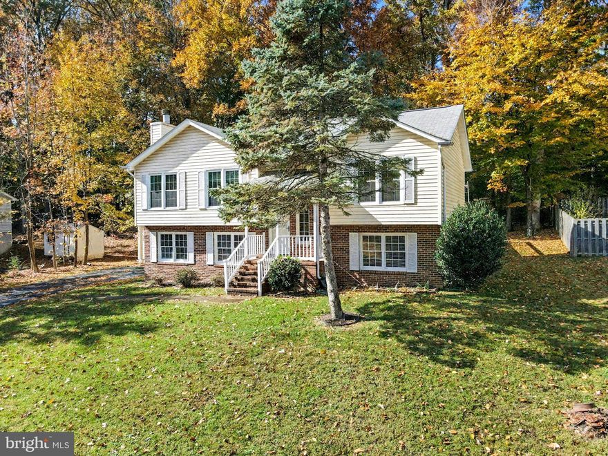 This beautifully maintained and updated bi-level home is ready for you to move in and start creating new memories. Meticulously cared for with years of TLC, it shines brighter than most, offering a perfect blend of comfort, style, and functionality.
Inside, you'll find a spacious layout featuring 3+ bedrooms and 3 full bathrooms. The kitchen and bathrooms boast sleek luxury vinyl plank flooring, complemented by fresh, plush carpeting throughout the rest of the home—creating an inviting atmosphere filled with warmth and modern elegance. The vaulted ceiling in the main living area draws the eye upward, enhancing the open, airy feel and making the space ideal for entertaining guests. A large deck off the dining area provides the perfect place for grilling and relaxing.
The primary bedroom can accommodate a queen-sized bed and includes a convenient en-suite with a single vanity and walk-in shower—your private retreat at the end of the day.  
Downstairs, the walkout leads directly to an oversized paved driveway, making parking and accessibility a breeze. The lower level features a welcoming living space with a cozy fireplace, abundant natural light, and plenty of room for gatherings. An additional finished flex space/bonus room offers versatile options—use it as an extra bedroom, home office, hobby room, playroom, or guest suite.  Completing this level is a modern full bathroom with a walk-in shower, a convenient laundry room, and a separate storage room.
Nestled on a beautifully landscaped lot backing to tranquil woods and located near a quiet cul-de-sac, this home provides privacy and low traffic living—perfect for families, professionals, or anyone seeking a peaceful retreat with easy access to nature and amenities.
Don’t miss the opportunity to make this exceptional property your new home!